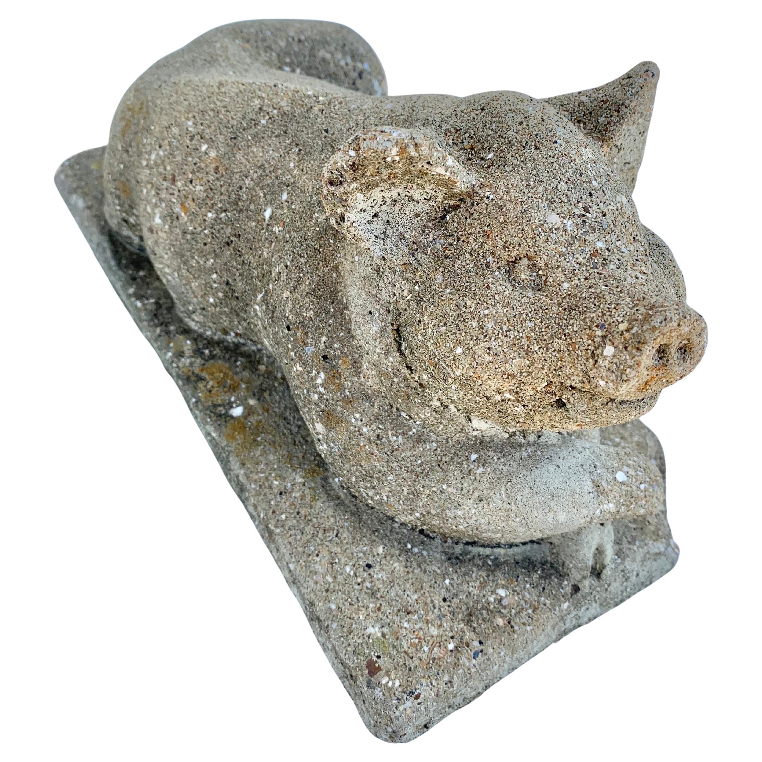 Decorate a kitchen counter or a patio with this adorable concrete pig. Made of concrete, the pig has a rich weathered texture finish and a wonderful patina. Two corner edges show aged chip imperfections, which only adds to the charm of the piece.