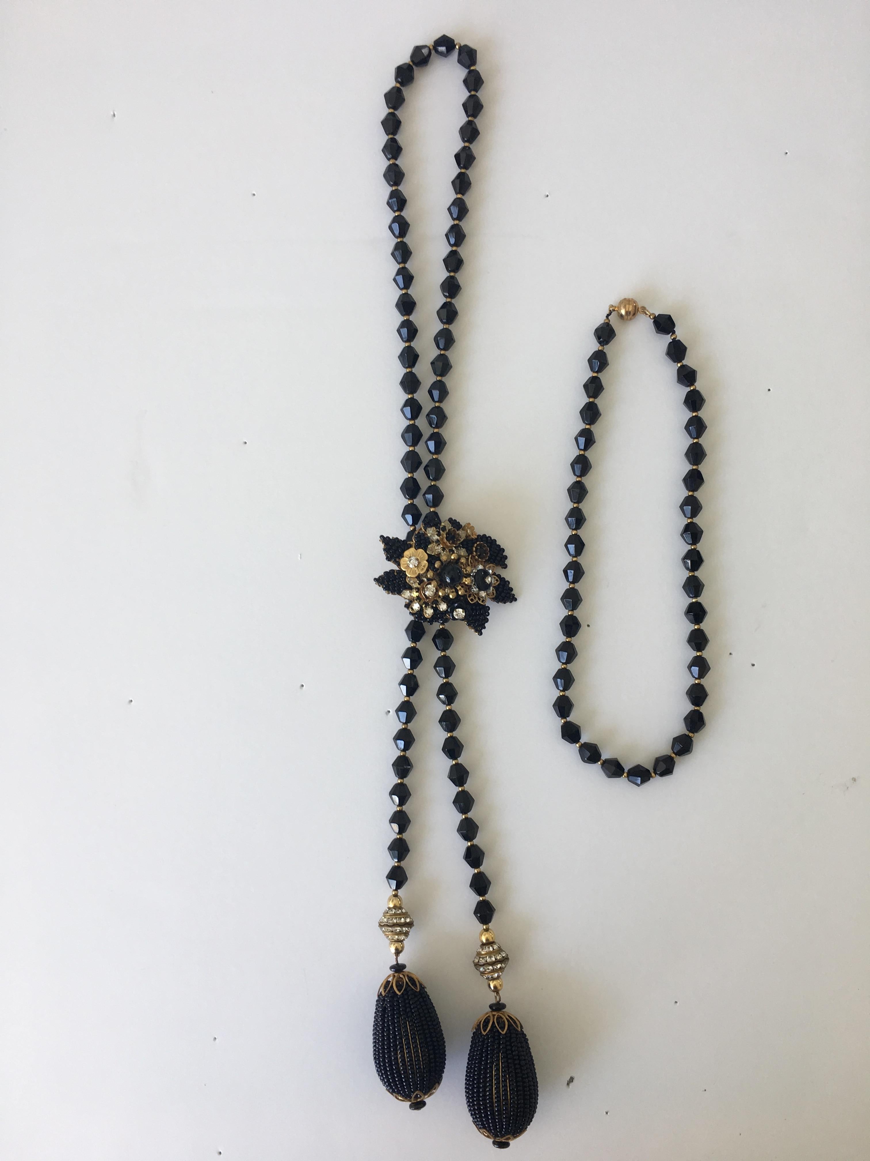 20th century vintage costume black bead and crystal lariat, choker and clip brooch, Probably Hagler.
This stunning Lariat necklace comes with an additional choker length necklace and the a separate clip brooch to hold the lariat in place. It has