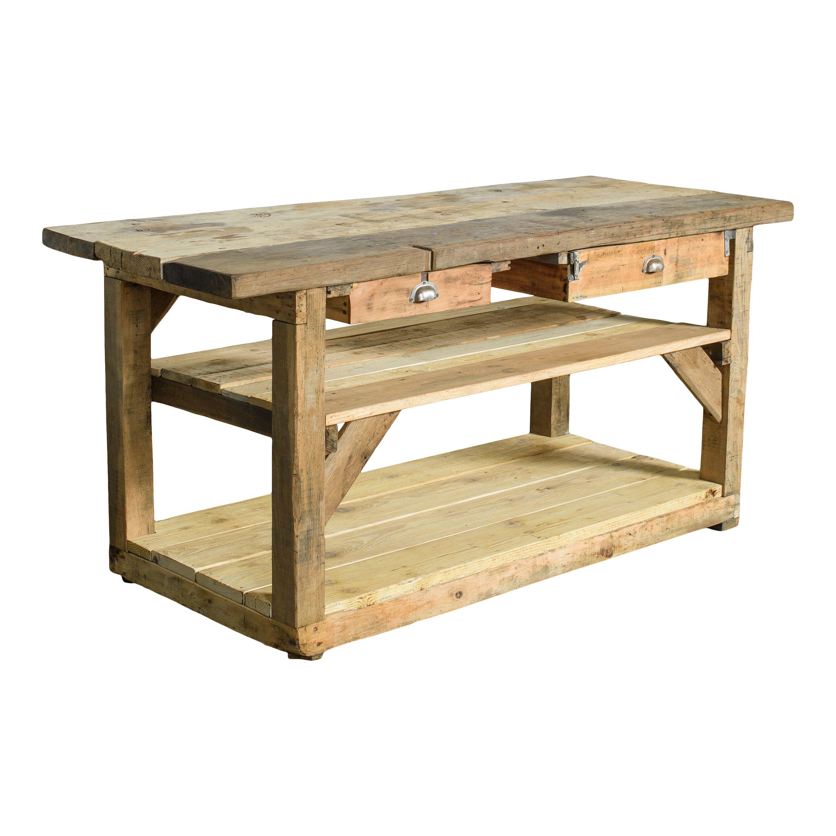 A perfect vintage wood island or console table with two simple drawers. The natural raw wood of this piece is warm and chic and features lovely patina from years of use and love. Two drawers pull out from right below the table top with classic metal