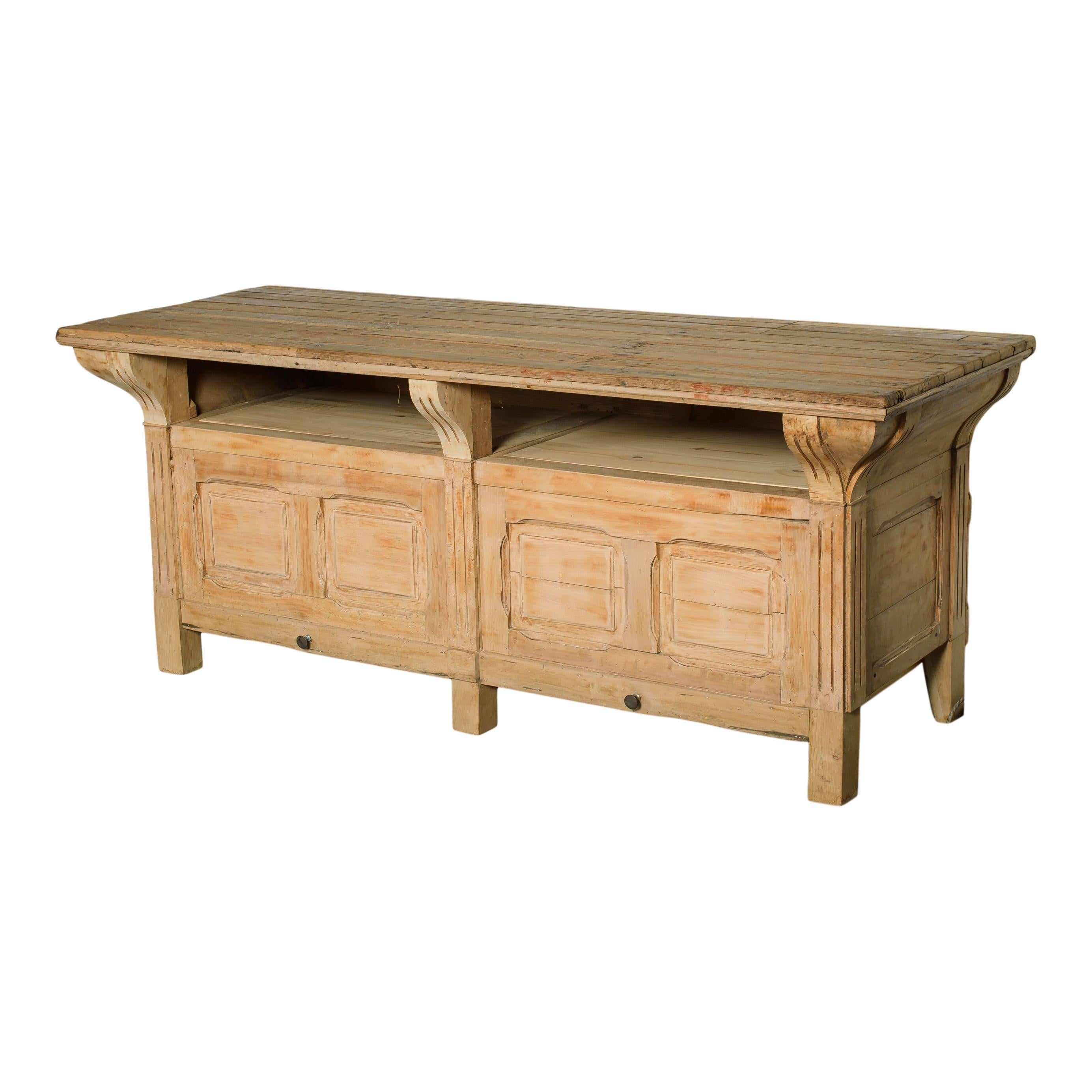 Vintage wood counter with storage from France. Can be used as a counter, sideboard, console table, or a storage and tabletop addition to any space. The table top is simple and natural oak wood with the light wear of years of use. The front features