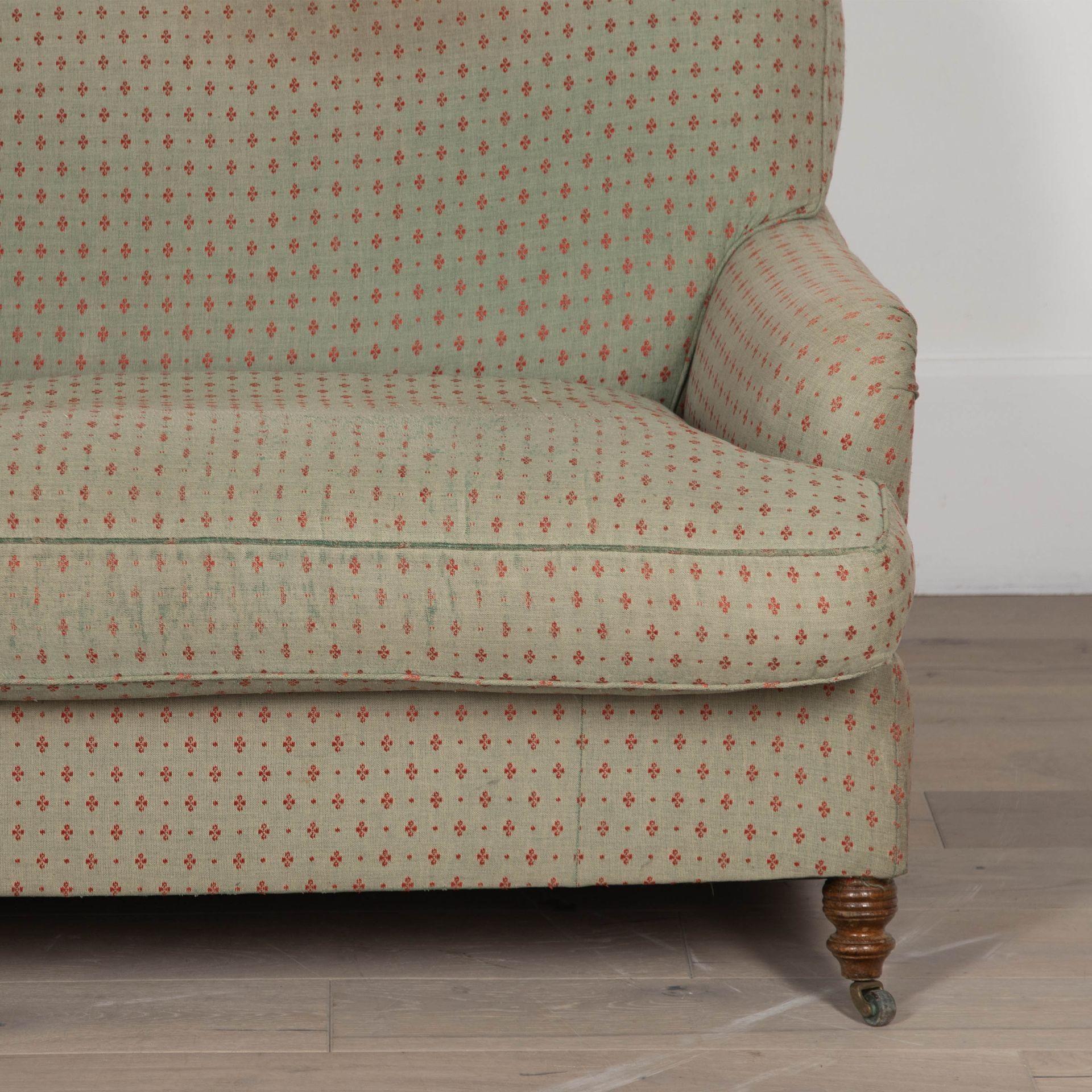 20th century great quality classic English country house Howard style sofa, by George Smith.
With elegant roll arms.
A traditionally sprung back and generous feather cushions giving sumptuous comfort and style.
In original fabric, wear commensurate