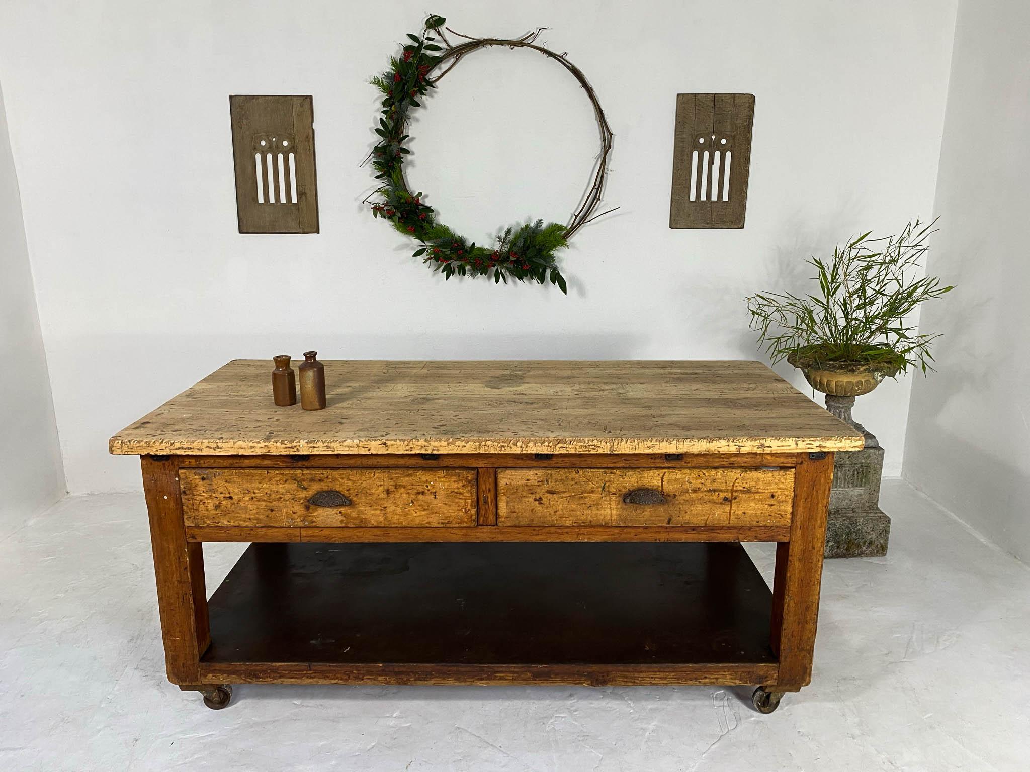 All original antique pine Baker's table, originally from a bakery in St Albans, England; but later used as an artist's table. We have cleaned and done some light restoration; lightly sanding and sealing the top so it is nice and smooth! We