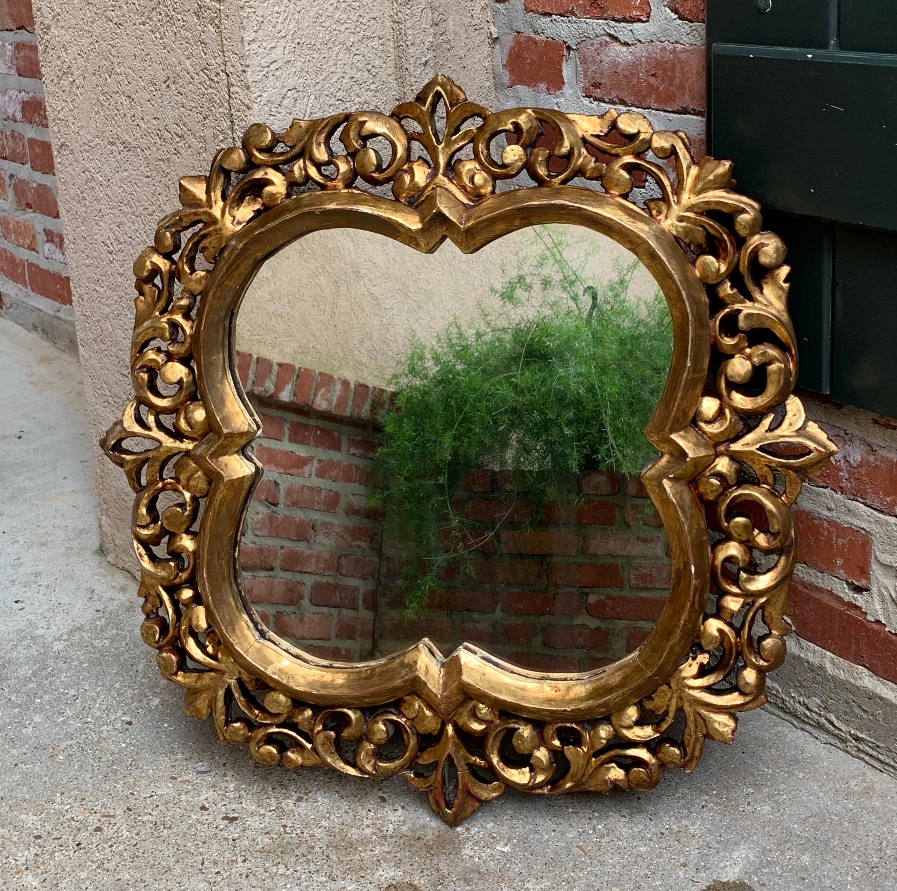 ~Direct from Italy~
~Beautifully shaped antique Italian wall mirror, gold gilt gesso frame with gorgeous details!~
~This is one mirror; there is a matching mirror available~
~circa 1920~

Measurements:
24.5