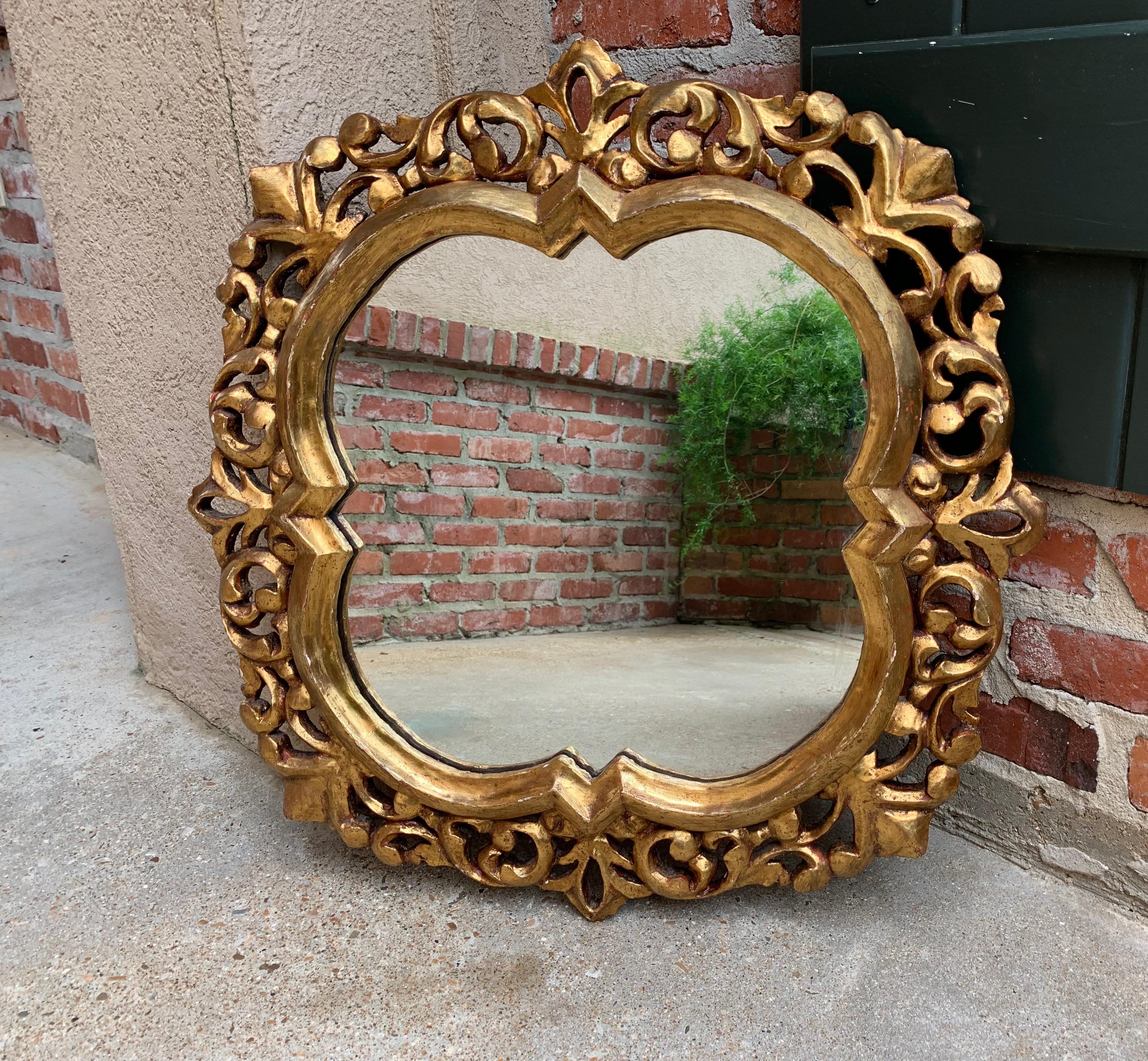 ~Direct from Italy~
~Beautifully shaped antique Italian wall mirror, gold gilt gesso frame with gorgeous details!~
~This is one mirror; there is a matching mirror available~
~circa 1920~

Measurements:
24.5