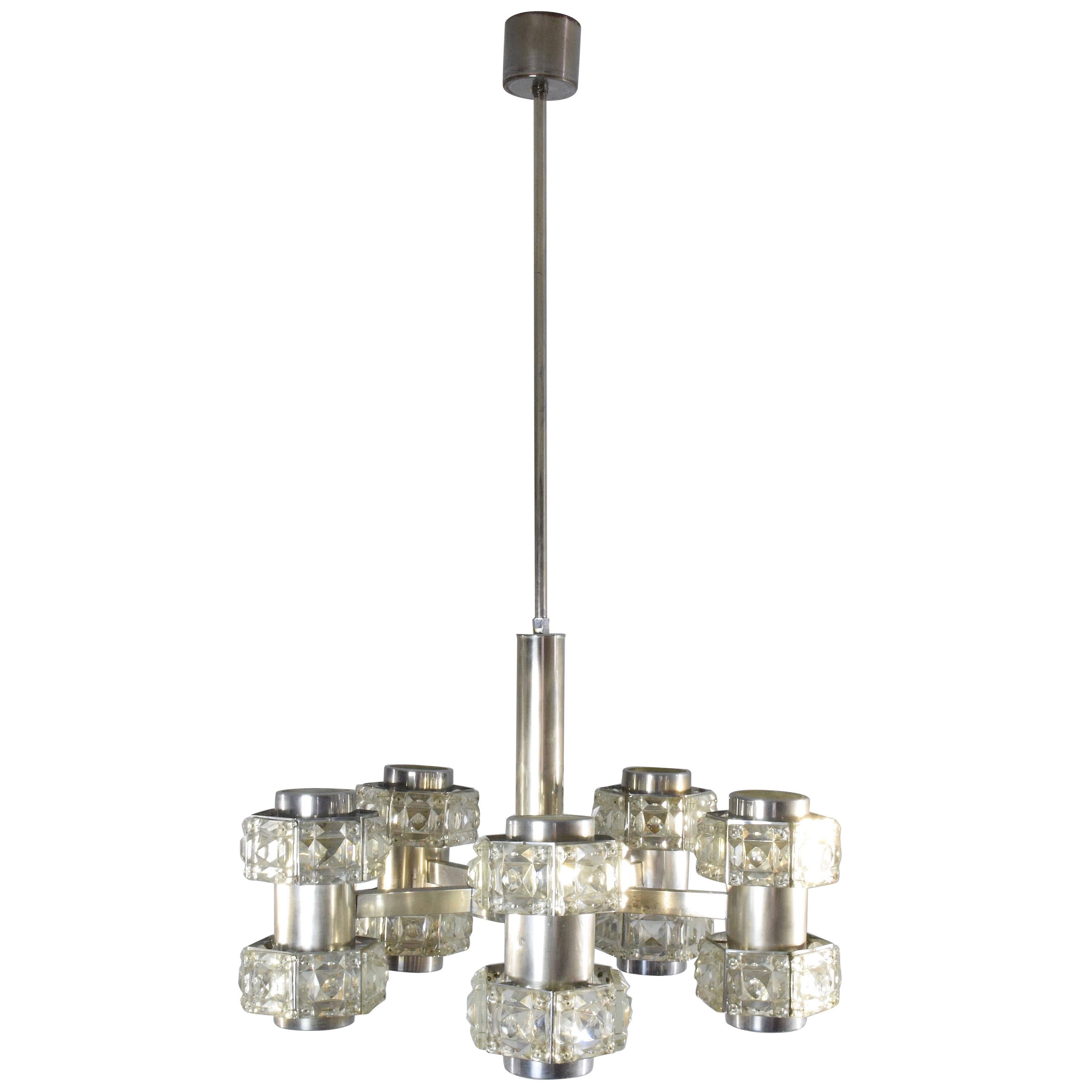 A 20th-century vintage Italian chandelier or pendant light fixture designed with five sublime pentagonal blown cut glass symmetrical lights totaling ten sockets mounted on a modern stainless steel structure.
Italy, circa 1960s-1970s. 
The rod can be
