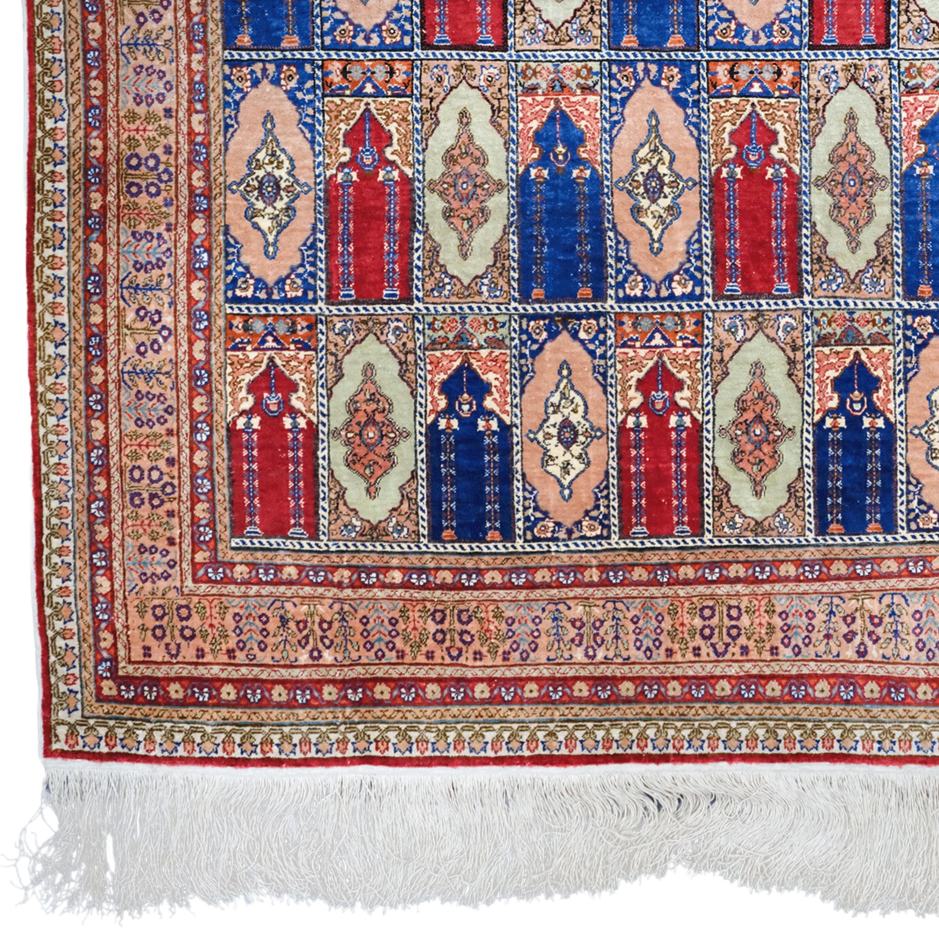 20th Century Vintage Kayseri Silk Rug

This 20th century antique Kayseri silk carpet is both a masterpiece of textile art and a work that has survived for centuries. Fine workmanship, geometric patterns and motifs are embroidered on the fabric of