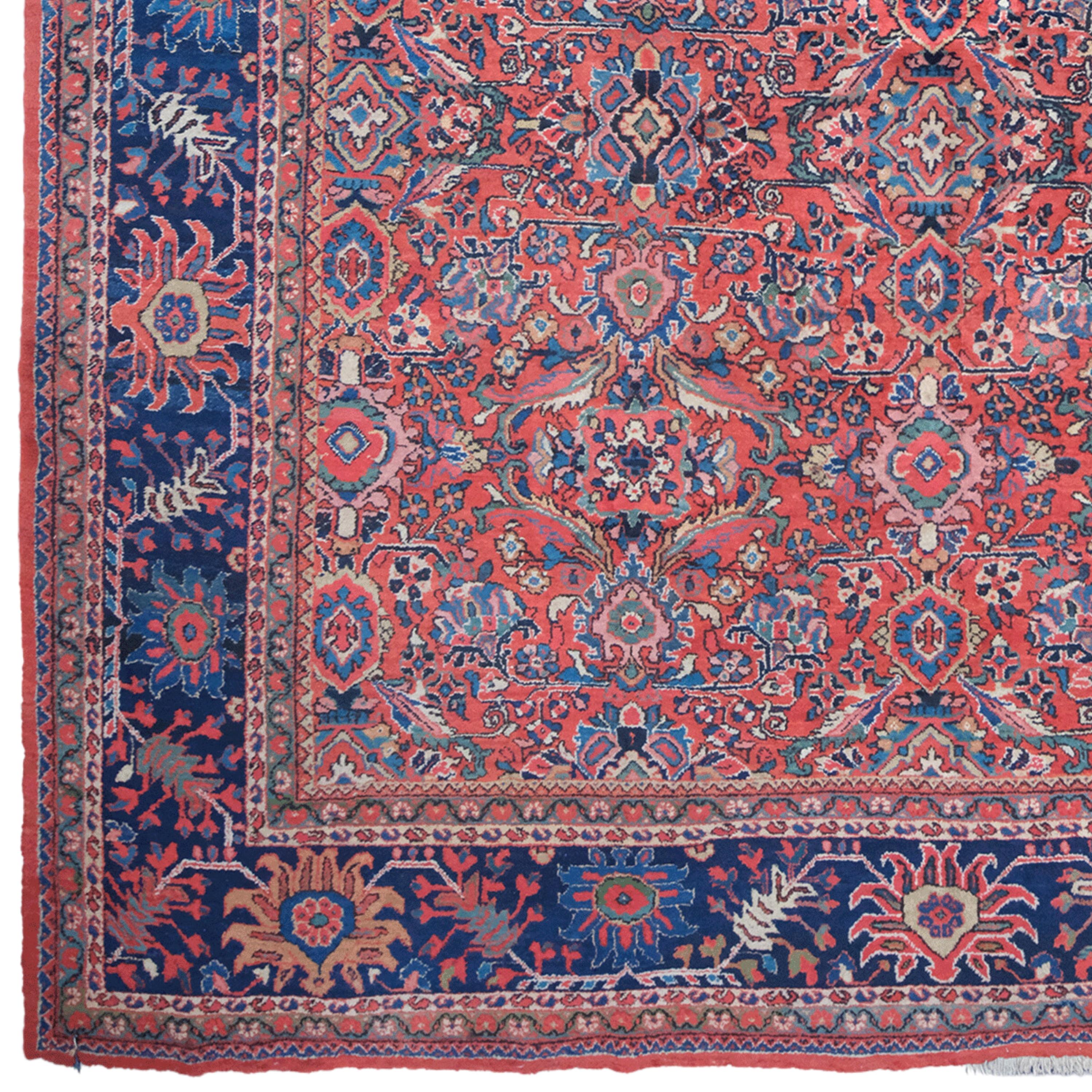 This early 20th-century antique wool Mahal rug is a masterpiece of traditional weaving art. Woven with fine craftsmanship and care, this impressive piece reflects the rich cultural heritage of its origins.

Central Area: Two central diamond-shaped
