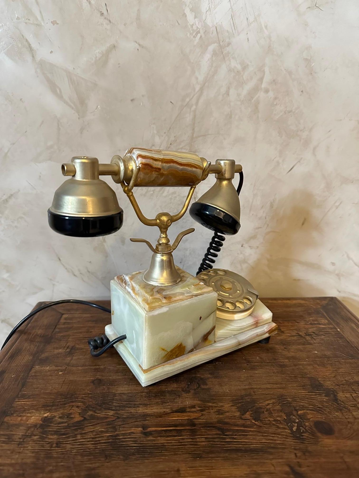 20th century marble phone made in Italy in the 60s. 
Green marble and brass. Still working. Very good state. Retro style.