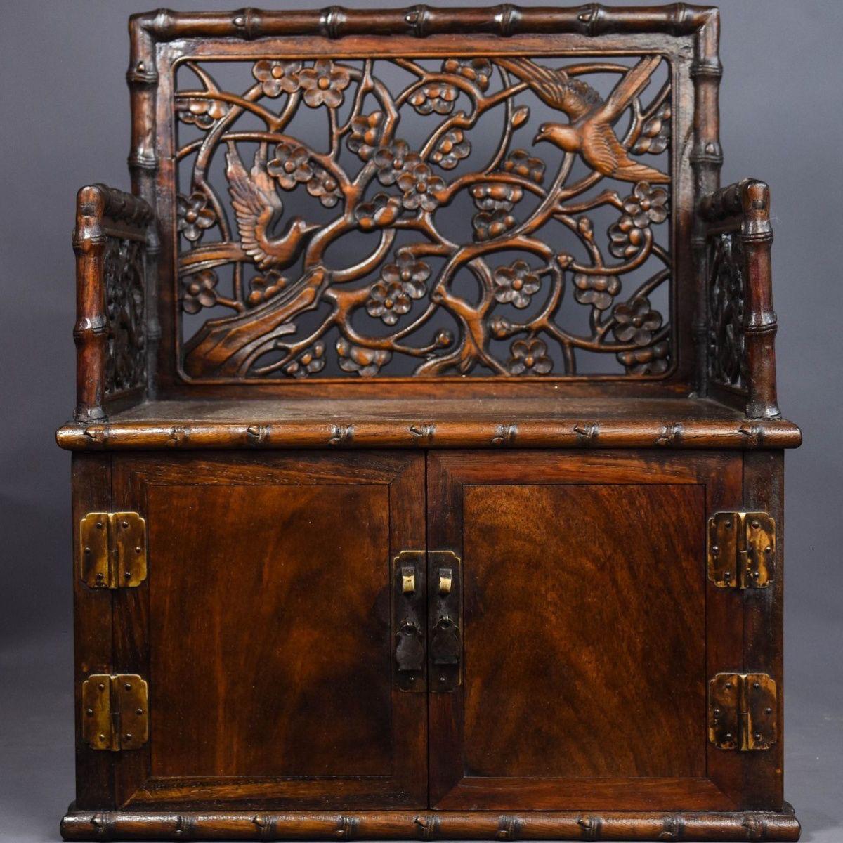 Add a touch of elegance and heritage to your space with this 20th Century Vintage Wood Chinese Engraving Birds Flowers Cabinet Chair. This exquisitely handcrafted chair showcases intricate bird and floral carvings, symbolizing prosperity, harmony,