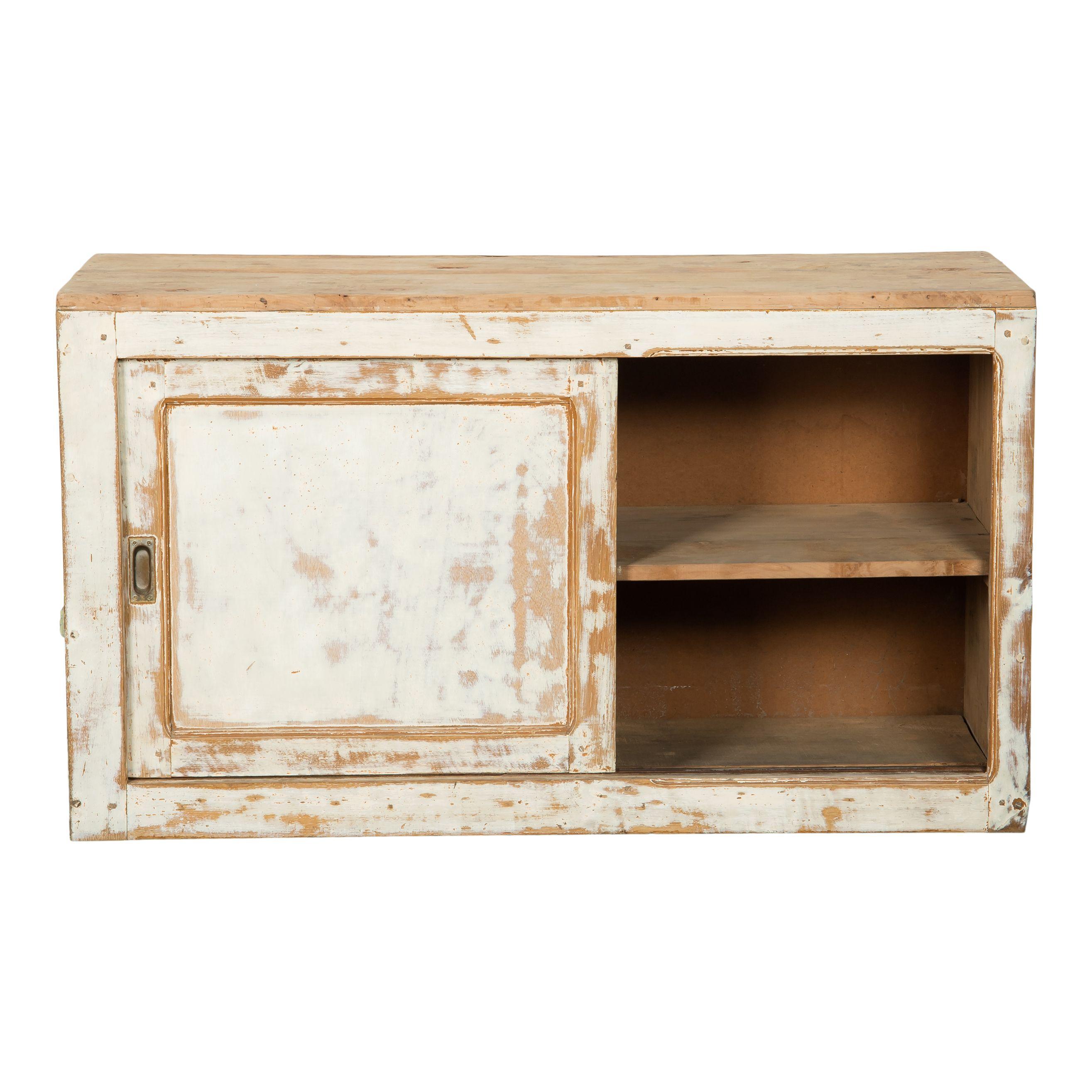 Vintage white wood cabinet with a door and shelves. This small cabinet has a simple design with a square door and two open shelves. It is wood and was painted white, which has created the perfect patina from years of use and love. Add this piece to