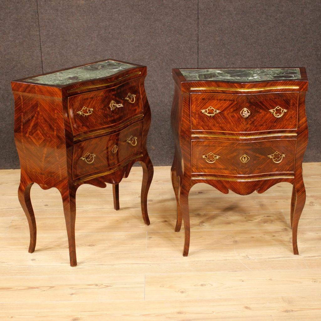 Pair of Sicilian nightstands from the early 20th century. Furniture in violet wood, elegantly inlaid. Bedside tables with two front drawers of good capacity and service, complete with two working keys, adorned with handles and decorations in gilded