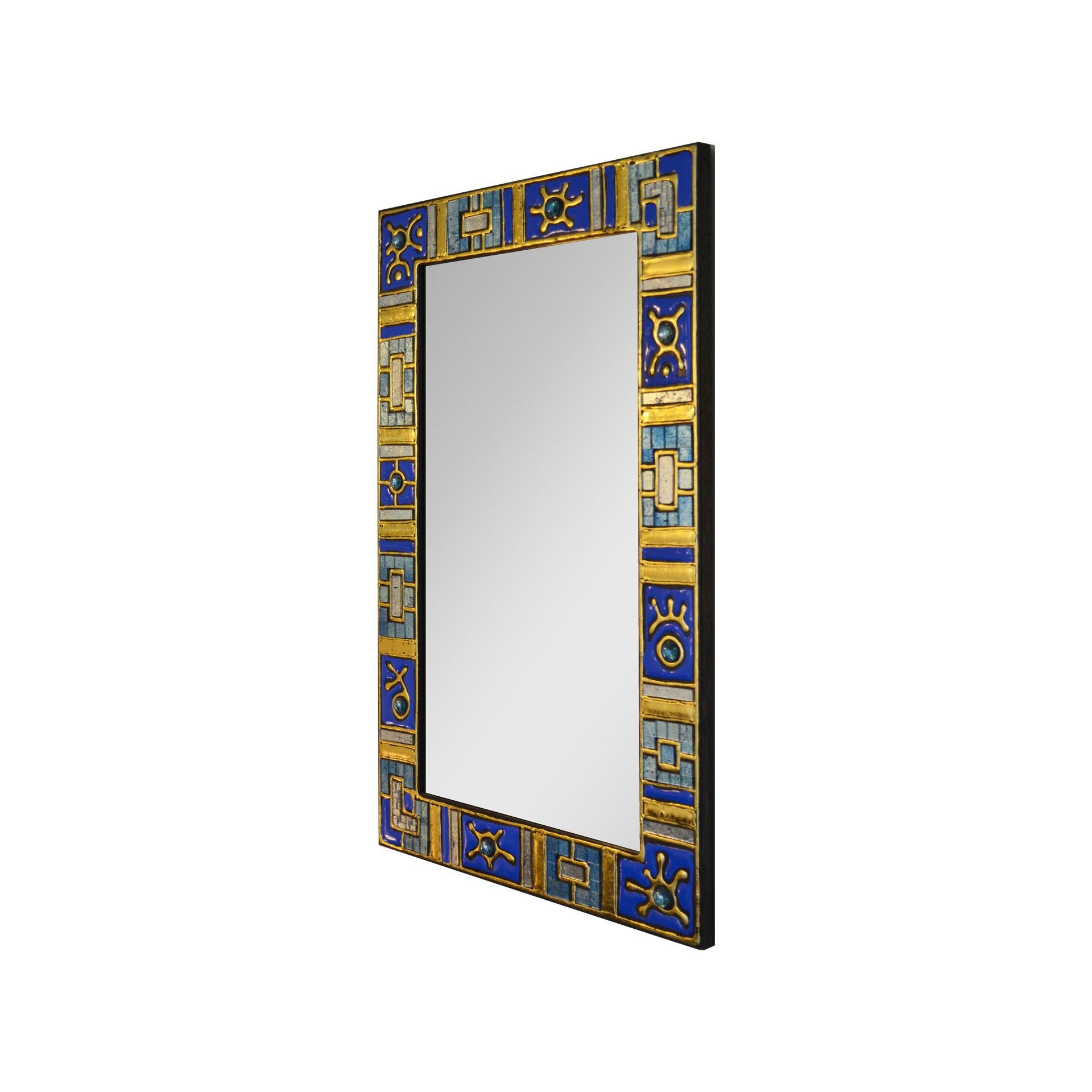 Wall mirror with very precious frame in wood decorated with glass paste and enameled glass, colors blue and golden. Designed and produced in France in 1960s.