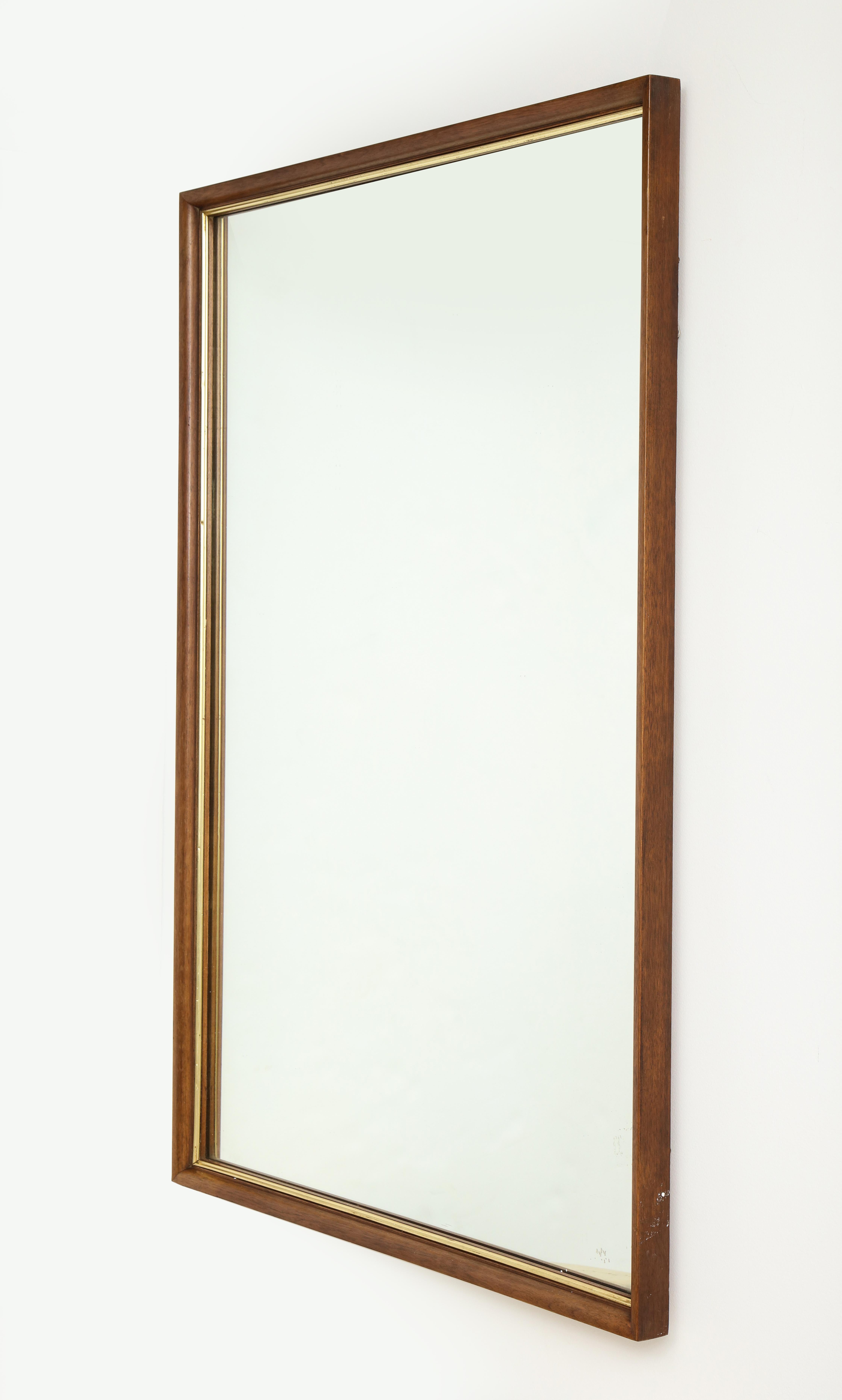 20th century walnut and brass mirror, signed 