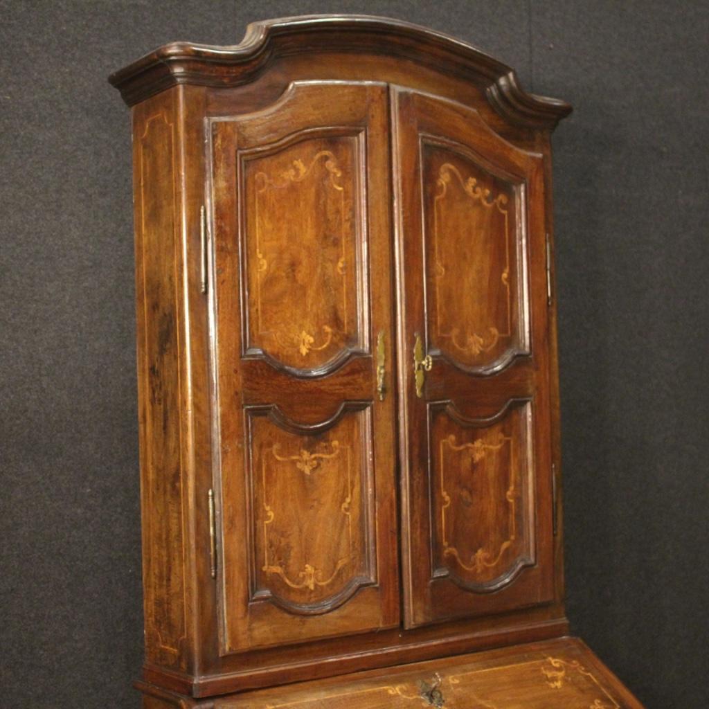 Piedmontese trumeau from the first half of the 20th century. Furniture carved in walnut with a pleasant maple inlay in Louis XV style. Double body trumeau equipped with three drawers and fall-front at the bottom. Fall-front that offers four drawers,