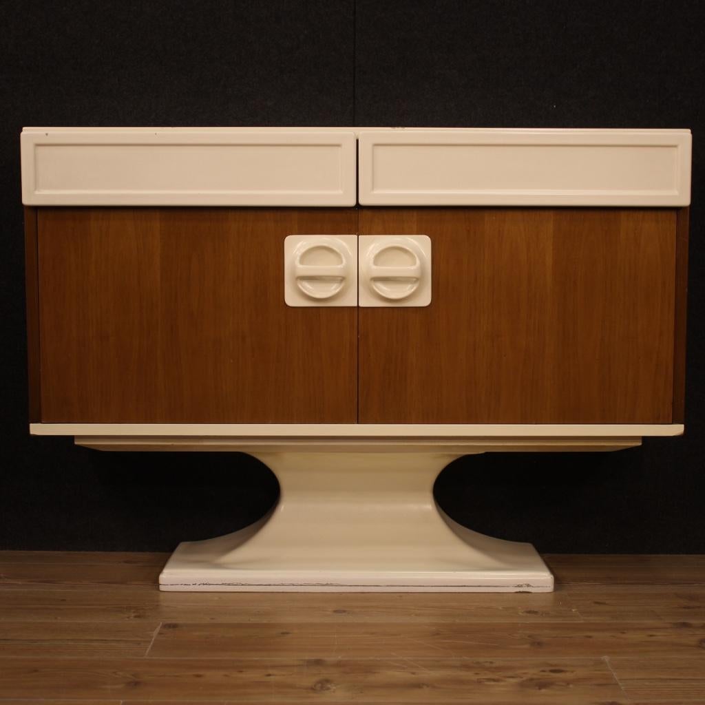 Italian design sideboard from 1960s-1970s. Furniture attributable to the production of Luigi Sormani in walnut wood with lacquered and plastic elements (see photo) of beautiful decoration. Sideboard equipped with two doors and two drawers of good