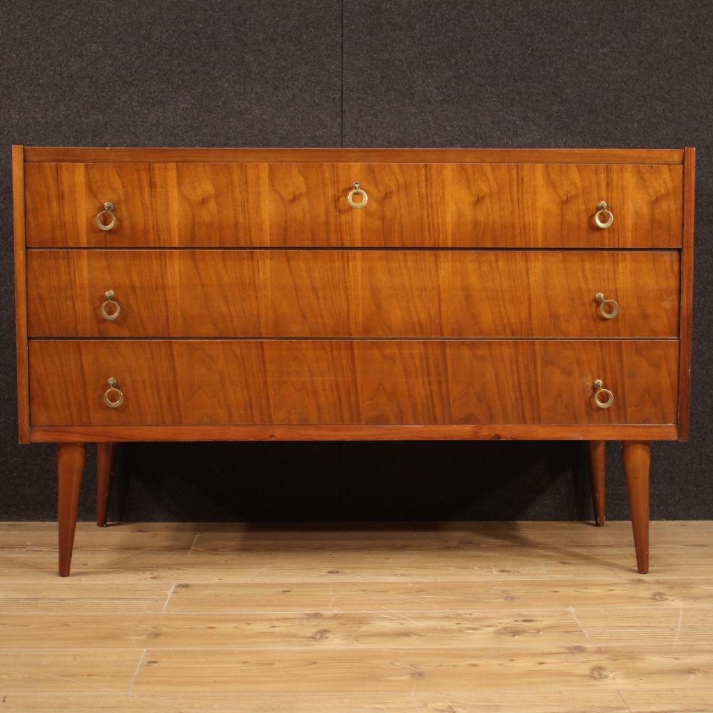 Italian design chest of drawers from the 1970s. Furniture of particular line and construction veneered in walnut, beech and fruitwood. Commode with three drawers of excellent capacity with wooden top in a good service character. Furniture of good