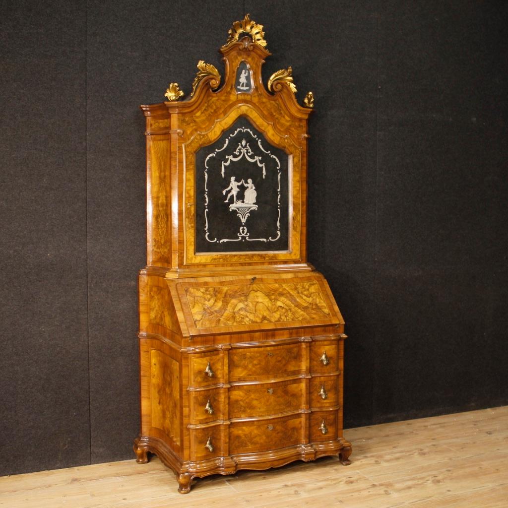 20th century Venetian trumeau. Furniture in walnut, burl walnut, rosewood, beech and fruitwood with a moulding adorned with inlaid mirror and carved and gilded elements. Trumeau fitted in the lower body with three external drawers of good capacity
