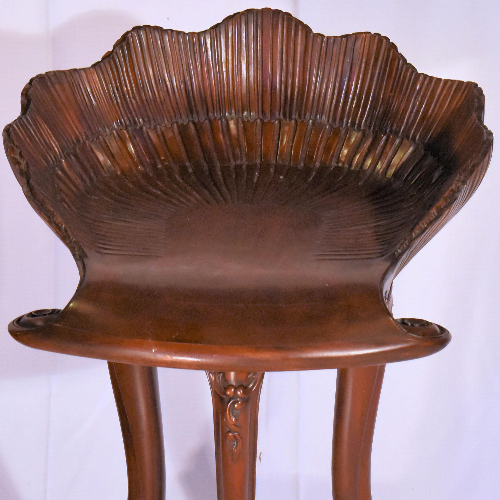This carved antique fruitwood grotto stool was created in Italy, circa 1950. Perfect as a piano stool or simply a statement piece, the seat has a 