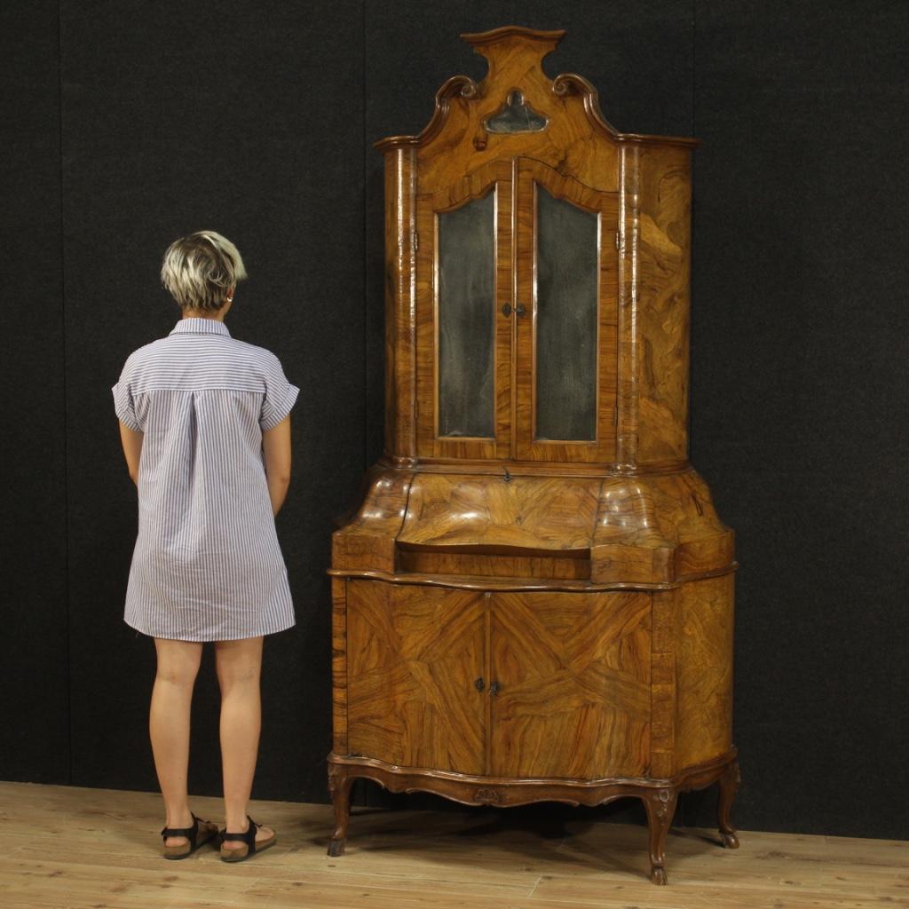 Venetian trumeau from the mid-20th century. Double body furniture carved and veneered in walnut, olive, burl and beech woods of beautiful lines and pleasant decor. Moved and rounded trumeau equipped with two doors and fall-front in the lower body.
