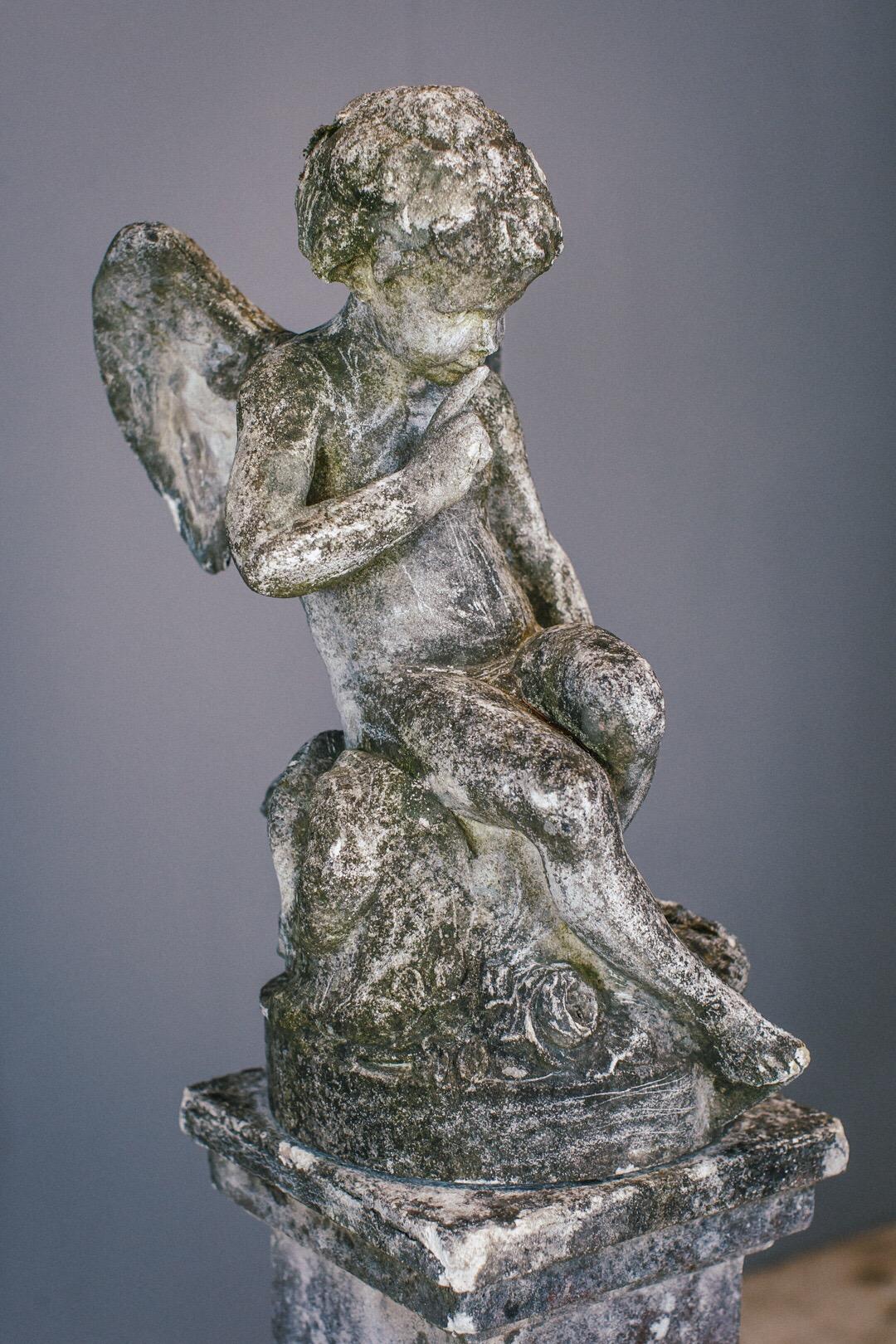 Weathered Angel statue and plinth. Wonderful patination and lichen growth. Composite.
          