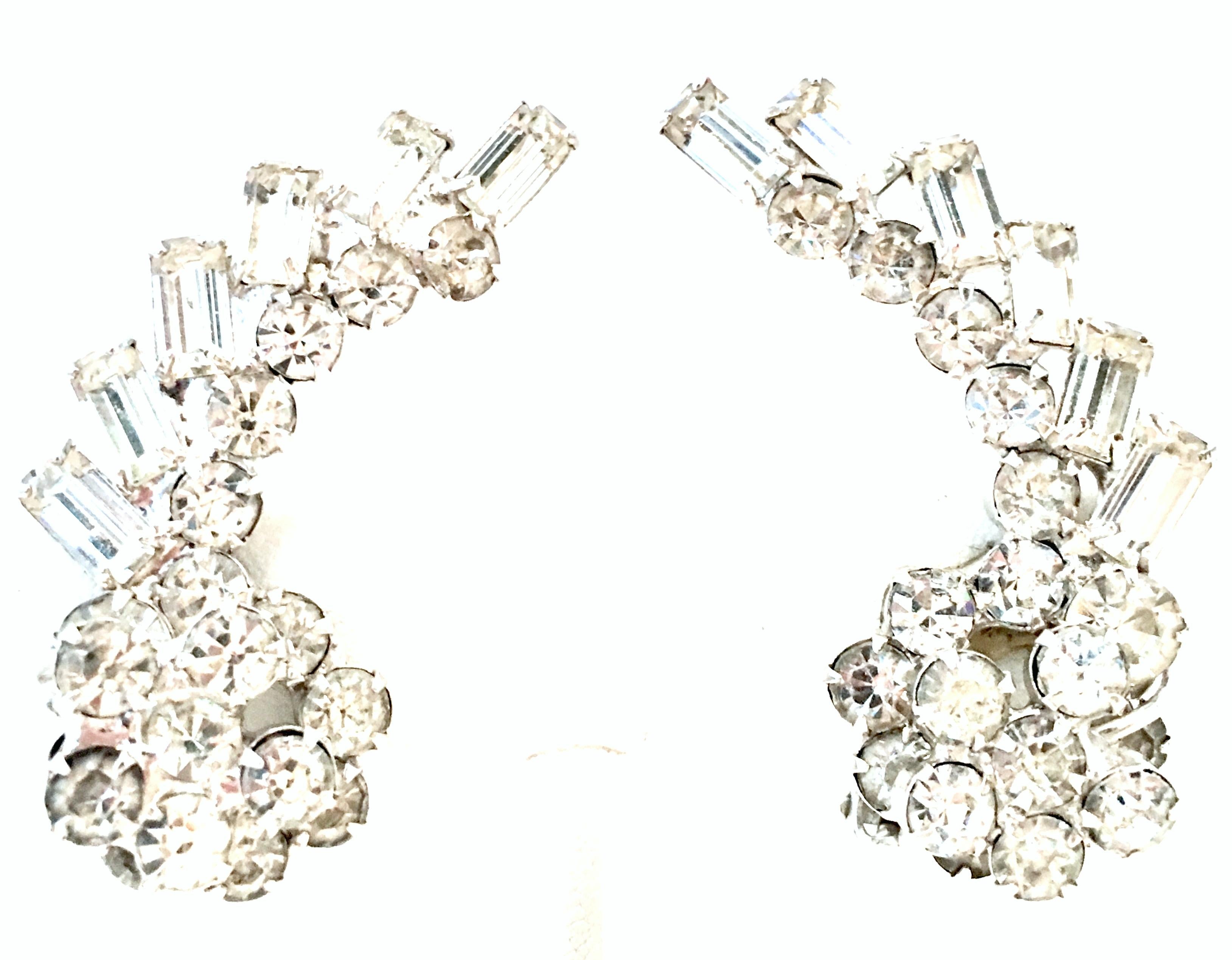 Mid-20th Century Weiss Style Silver & Austrian Crystal Earrings. These silver rhodium plate clip style earrings feature brilliant cut and faceted colorless prong set crystal stones. These 2