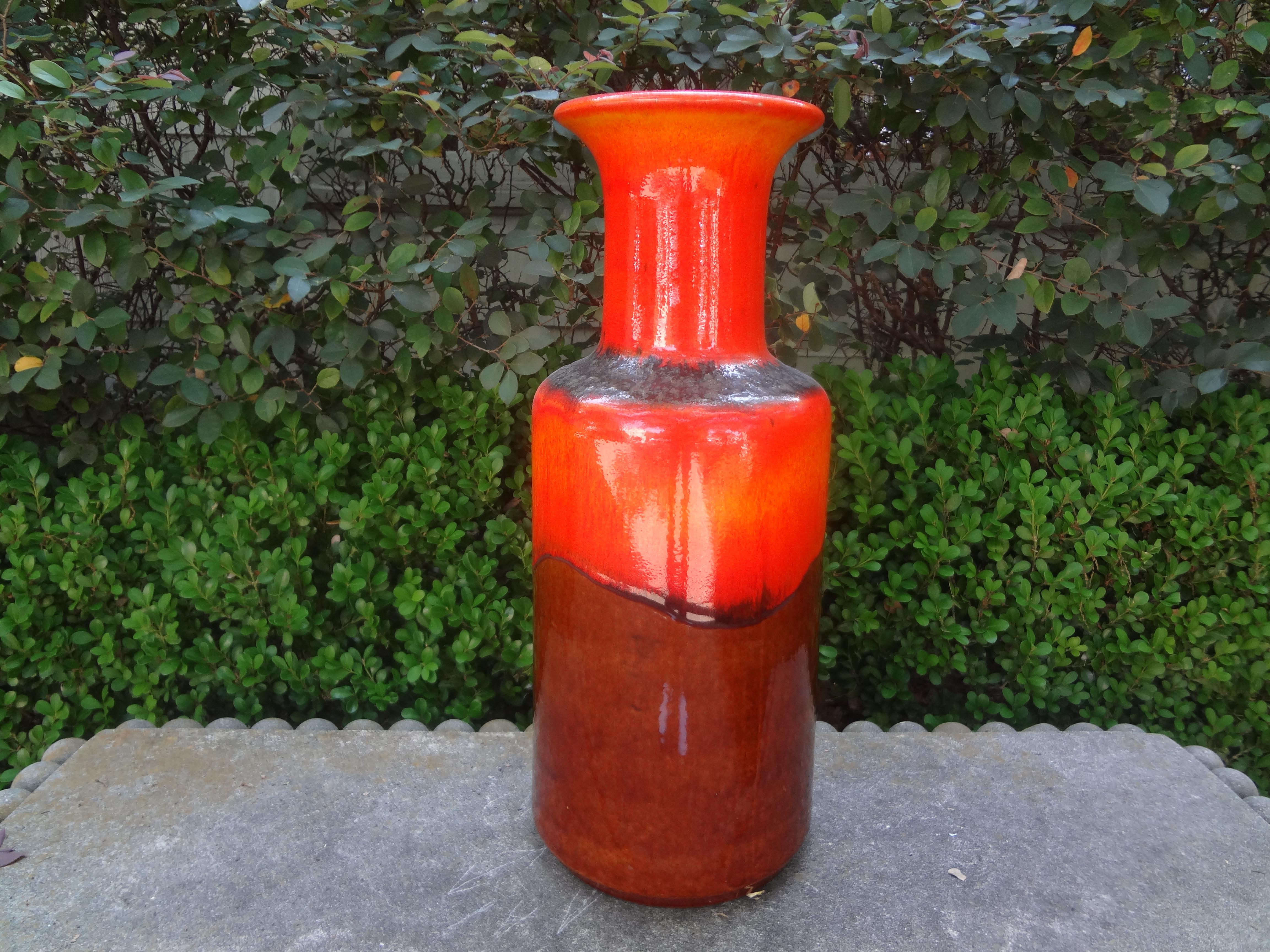 20th century West German Glazed Pottery Vase.
This handsome tall mid-20th century West German glazed pottery vase is executed in orange and brown tones.
Just one of our large collection on 1stdibs!
 