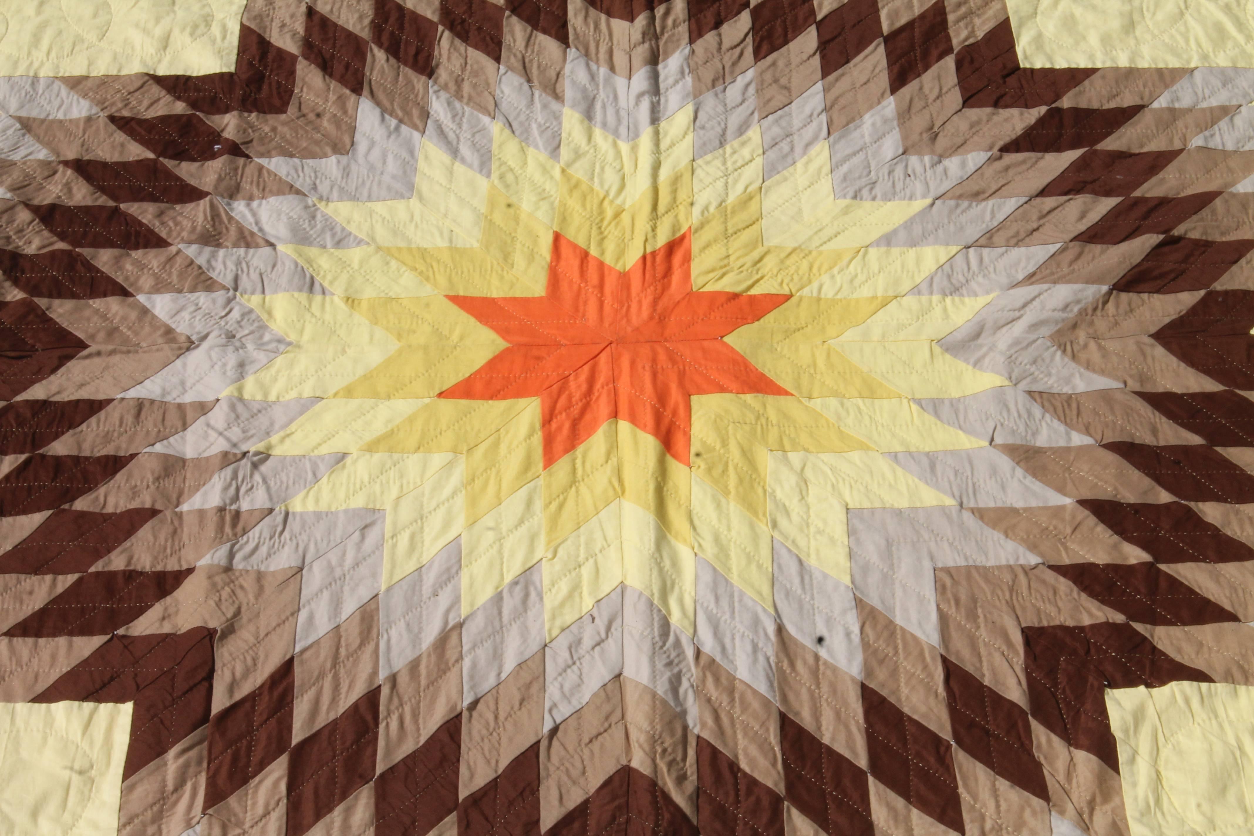 Eight point star quilt in Western colors. Indian sunset broken star quilt. This quilt is in pristine condition and will fit a queen or king bed. The piecing and quilting is very good.