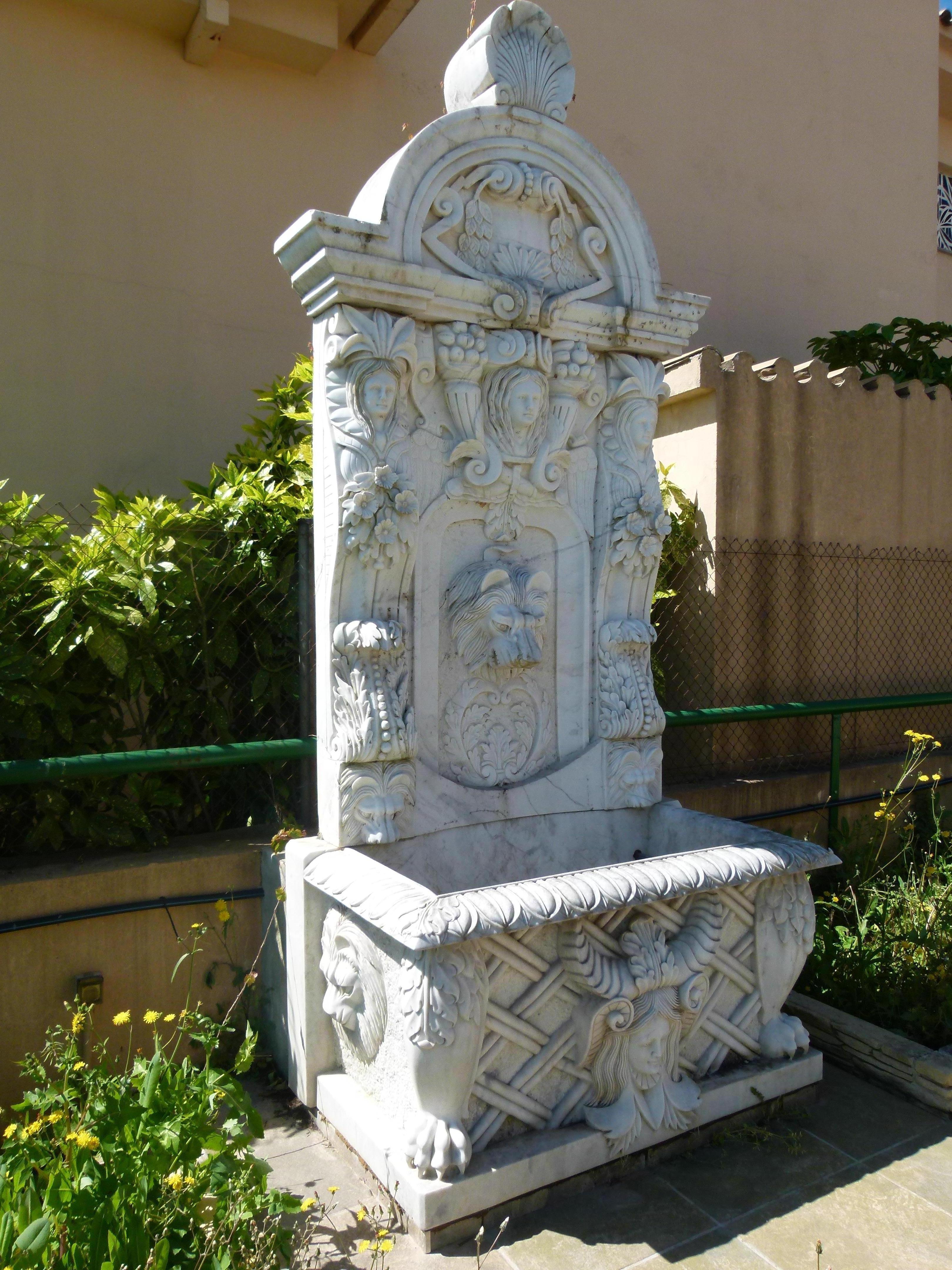 Hand-Carved 20th Century White Carrera Marble Wall Fountain