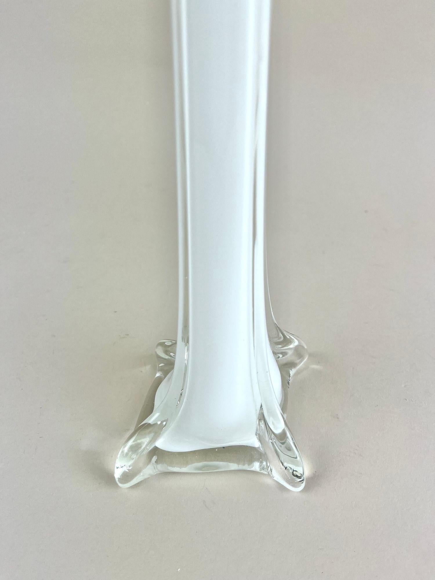 Artfully designed, slim Murano glass vase from the famous glass art workshops. Made in Italy in the mid century period around 1960 this elegantly glass vase impresses with its beautiful flashed glass technique in a timeless white tone. The