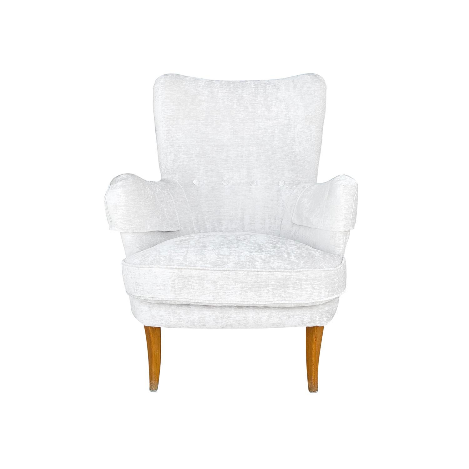 A white-grey, vintage Mid-Century Modern Swedish anonymous armchair with two pillows, designed by Carl Malmsten, in good condition. The seat backrest of single Scandinavian Little Furulid side chair is slightly curved with outstretched arms,