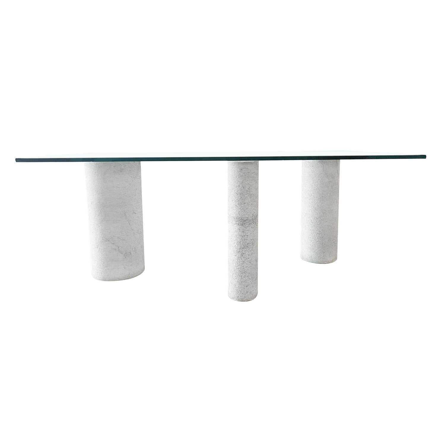 A white-grey, vintage Mid-Century Modern Italian large dining table made of hand crafted marble, designed by Massimo Vignelli in good condition. The sculptural table is consisting a thick glass top, supported by three cylindrical bases of different