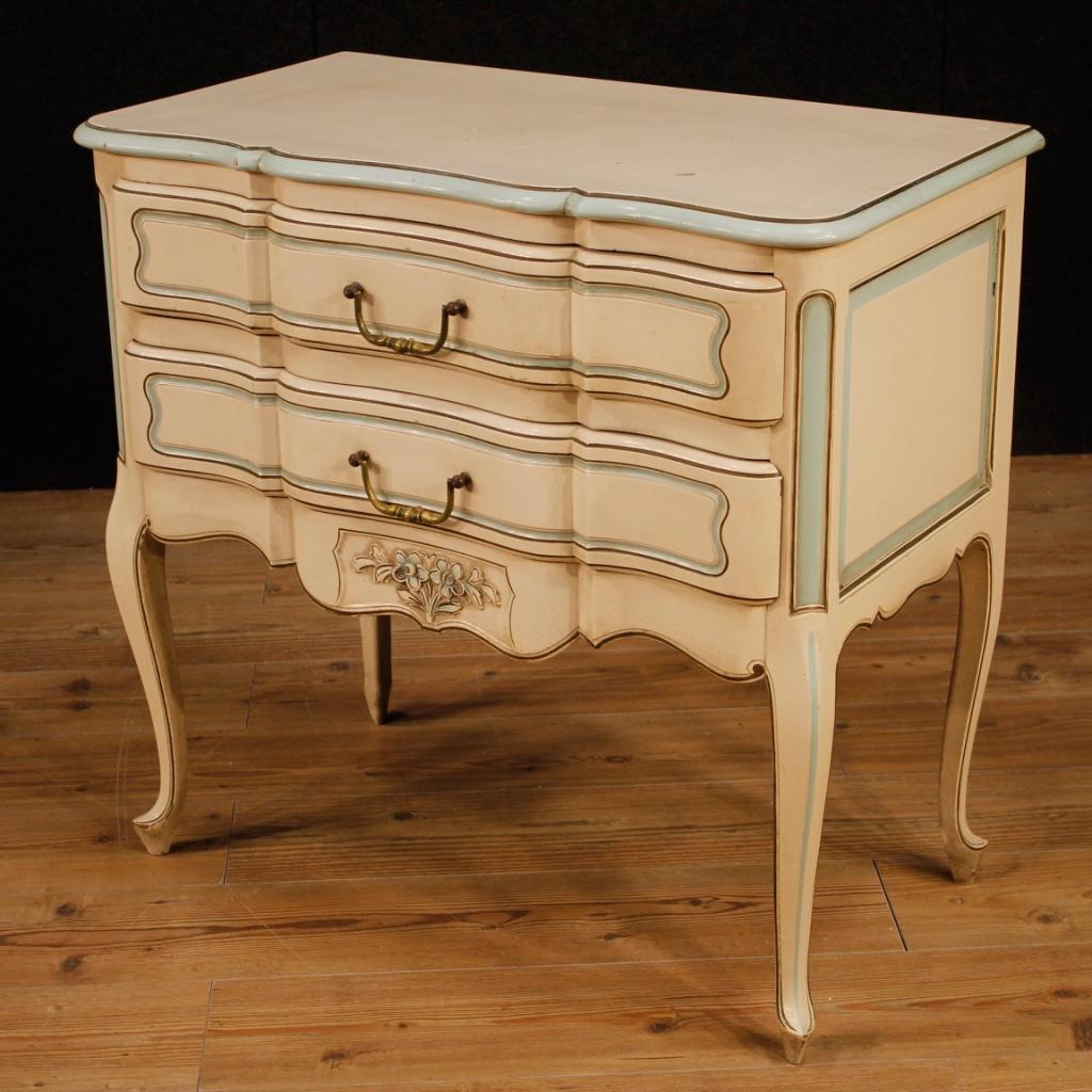 French dresser from 20th century. Beautiful line furniture of nice decor in lacquered and painted wood. Chest of drawers with two front drawers, of good capacity. Wooden top of good service. Small commode of excellent proportion, it can be easily