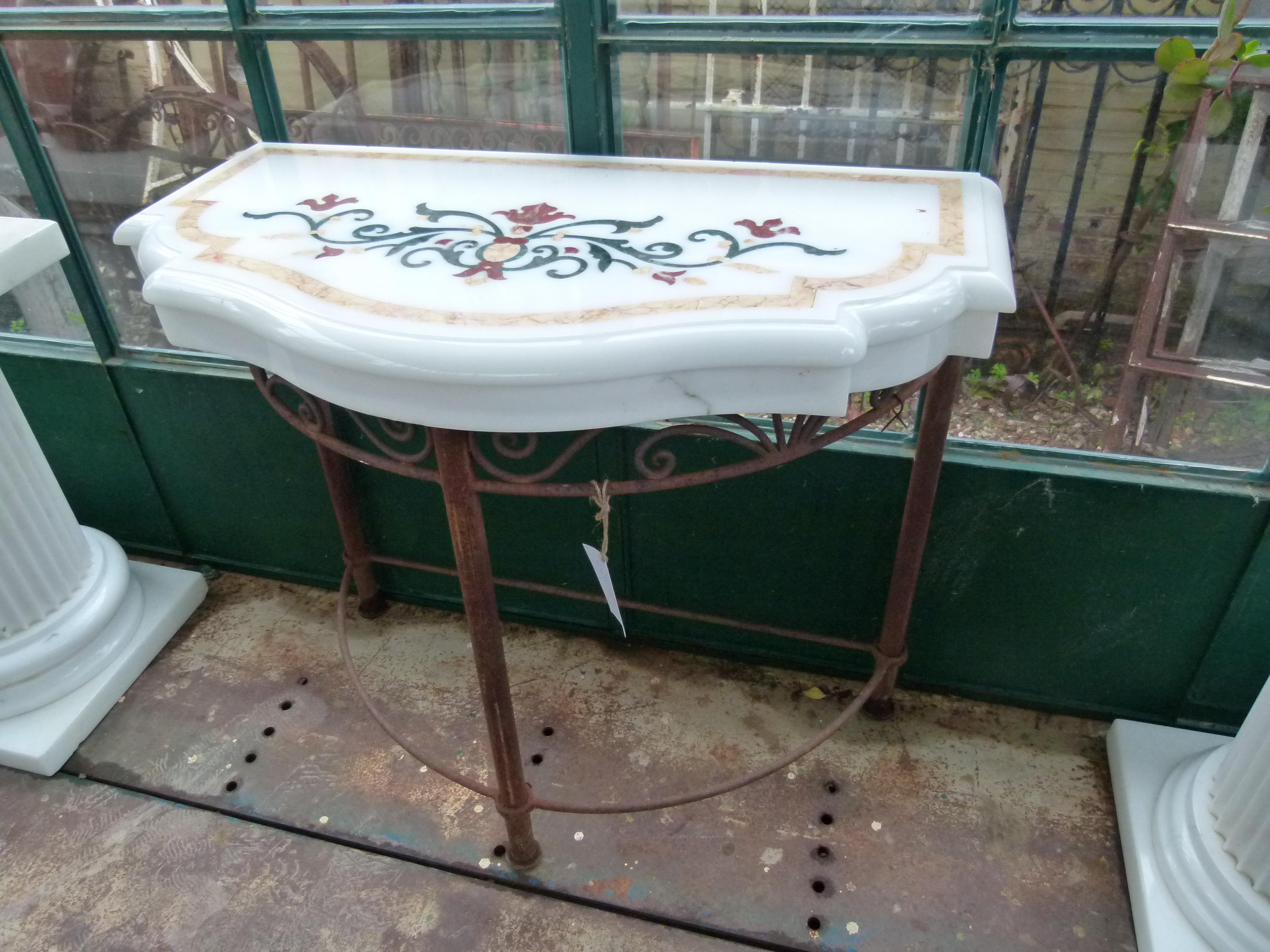 20th Century white marble Spanish console.
Marble Inlaid with colored decorative flowers, 
Stabil wrought iron feet.