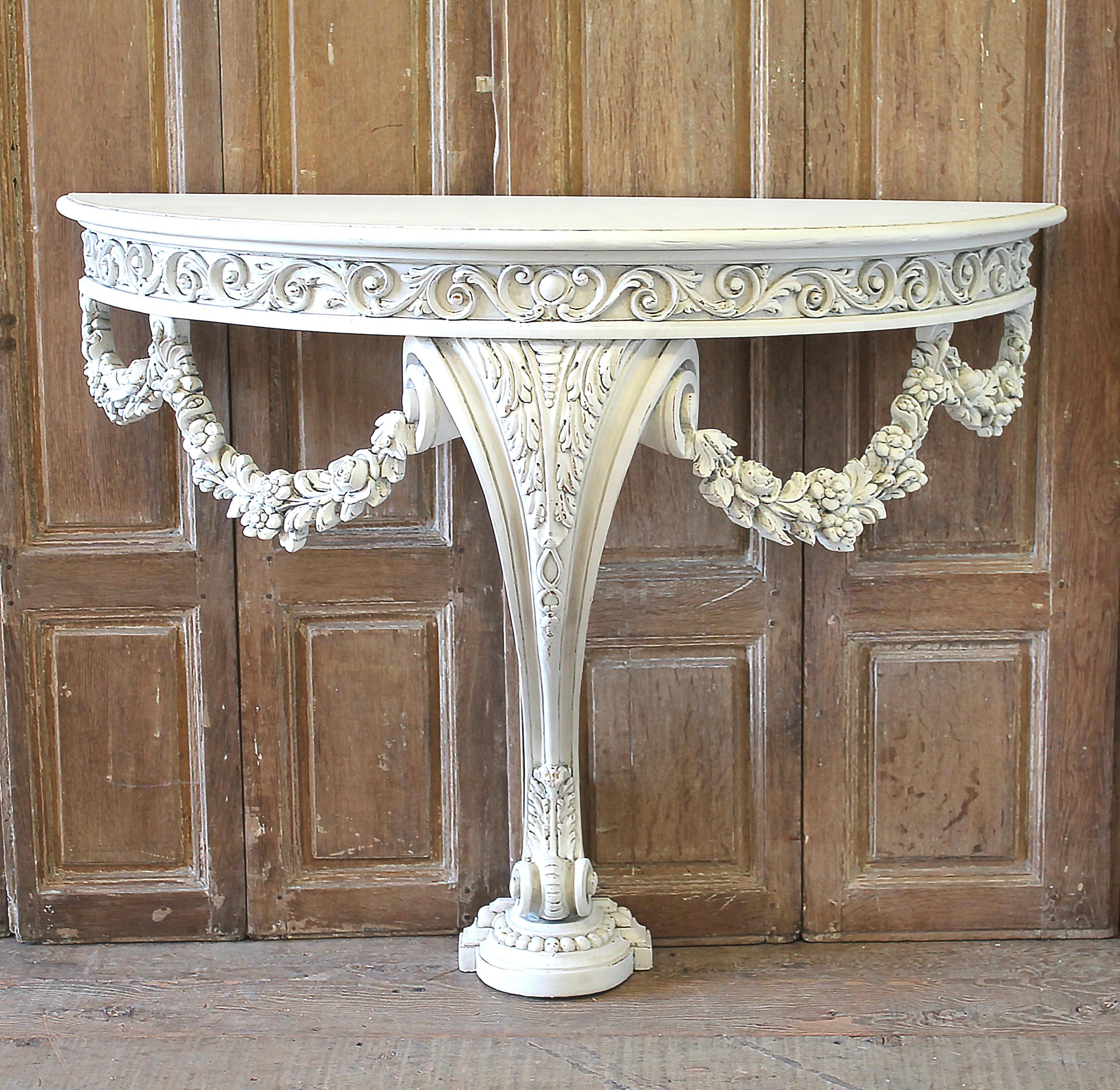 20th century white painted rose swag console table
Measures: 17.5