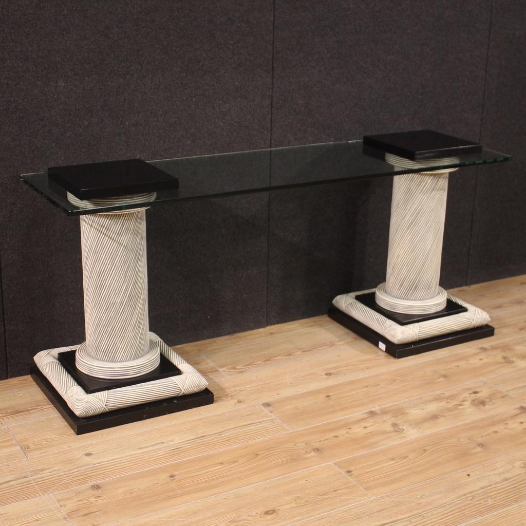 Particular design console, Spain from the 70s/80s. Furniture composed of two columns adorned with wicker with black lacquered wooden elements and glass top. Glass top equipped with special holes to be fixed to the columns (see photo). Console that