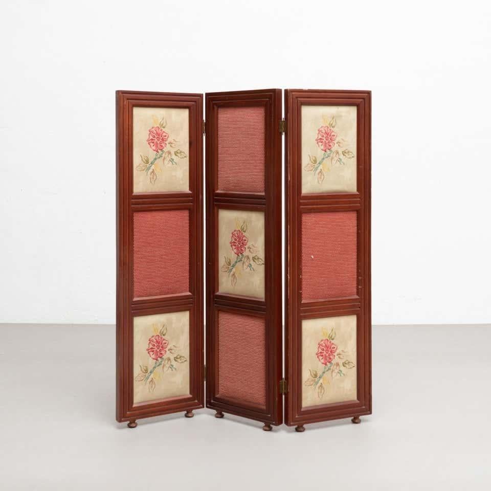 20th Century Spanish folding hand painted room divider.    By unknown manufacturer from Spain.    In good original condition, with minor wear consistent with age and use, preserving a beautiful patina.    Material:  Wood  Fabric.   