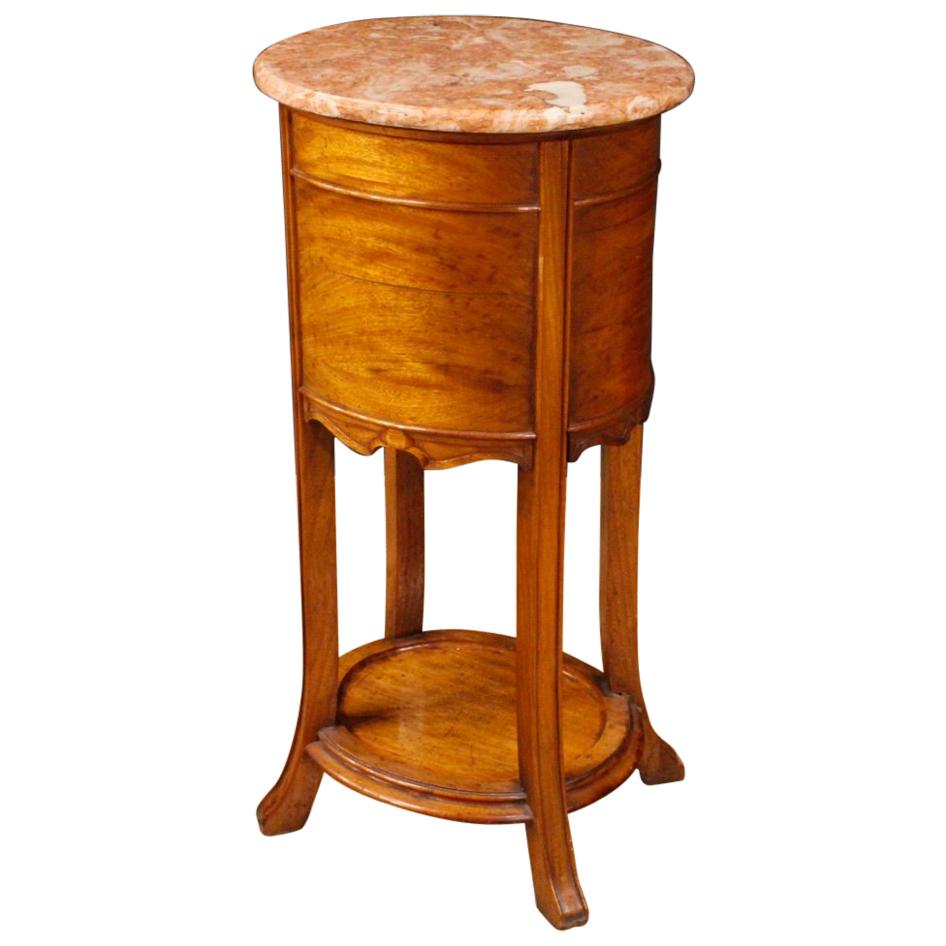 20th century Dutch side table. Art Nouveau style furniture in carved and chiseled wood with marble top. Nightstand with one door and one drawer with a second shelf in the lower part. Interior of the door covered in enameled metal (see photo). Top in