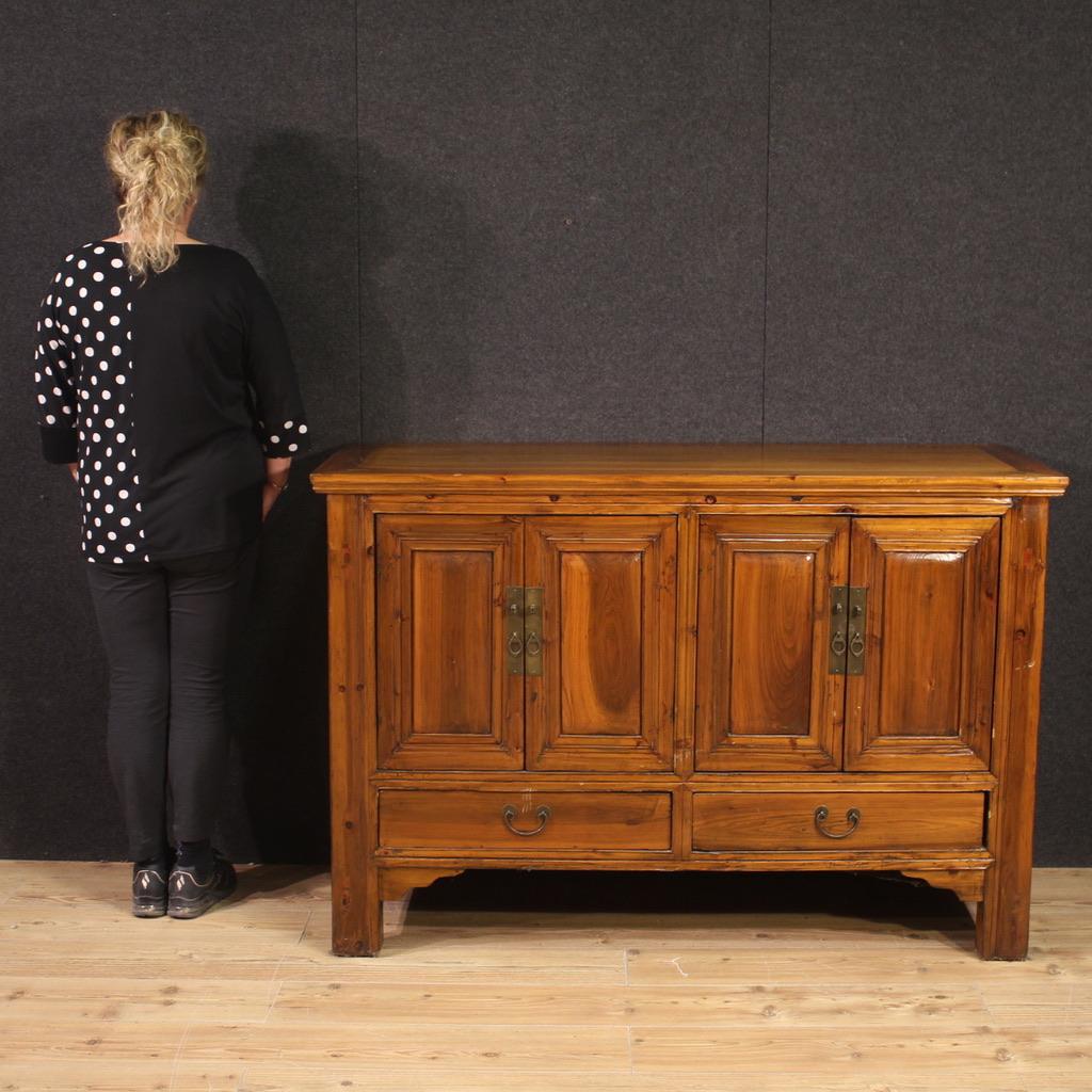 Chinese sideboard from the second half of the 20th century. Wooden cabinet with four doors and two drawers of excellent capacity and service. Sideboard with a modern design and excellent proportions, it can be easily placed in different parts of the