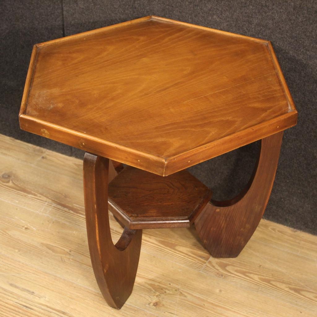 French coffee table from the mid-20th century. Furniture carved in oak and beech, hexagonal in shape, resting on three legs with a central joint (see photo). Coffee table that offers a good size support top and service with a wooden frame applied