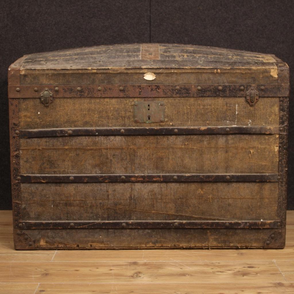 French travel trunk from the mid-20th century. Furniture in wood, canvas, cardboard, sheet and iron with vintage labels of various hotels, in fabulous patina. Great furnishing object, ideal to be placed in a showcase as a piece of furniture for