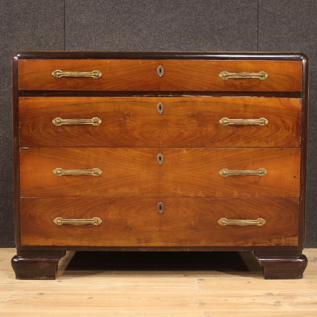 Italian dresser from the mid-20th century. Furniture in Art Deco style of beautiful line and pleasant decor in mahogany, cherry, ebonized wood and beech. Chest of drawers equipped with four drawers of good capacity and wooden top in character of