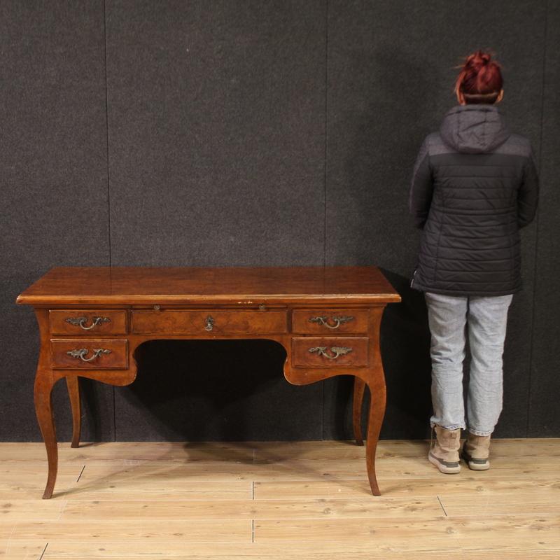 Italian writing desk from the mid-20th century. Curved piece of furniture in Louis XV style, veneered in poplar burl and fruitwood, of beautiful line and pleasant furnishings. Desk finished for the center equipped with 5 large drawers and a pull-out