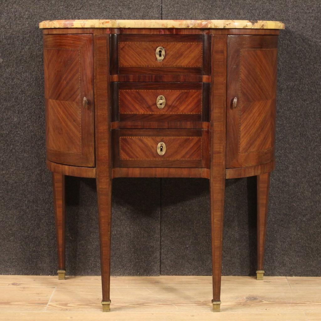 Small French dresser from the early 20th century. Furniture of particular shape and proportion inlaid in mahogany, maple and fruitwood. Dresser equipped with three central drawers and two side doors of good capacity and service. Top in original
