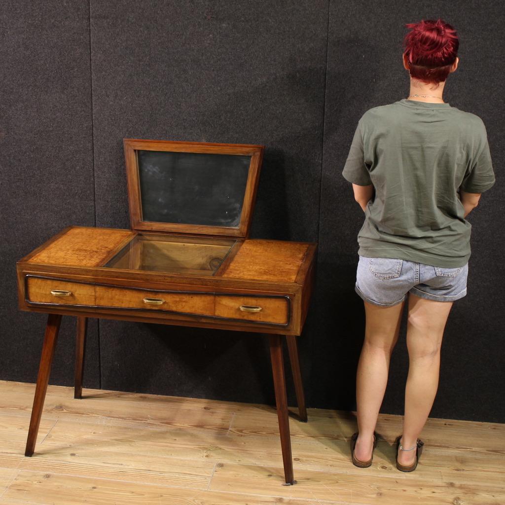 Console table with mirror, Italy, 1970s design. Fabulously designed furniture, veneered in thuja burl with ebonized drawer trim. Small desk with three parallel drawers adorned with original gilded brass handles (see photo). A well-sized and