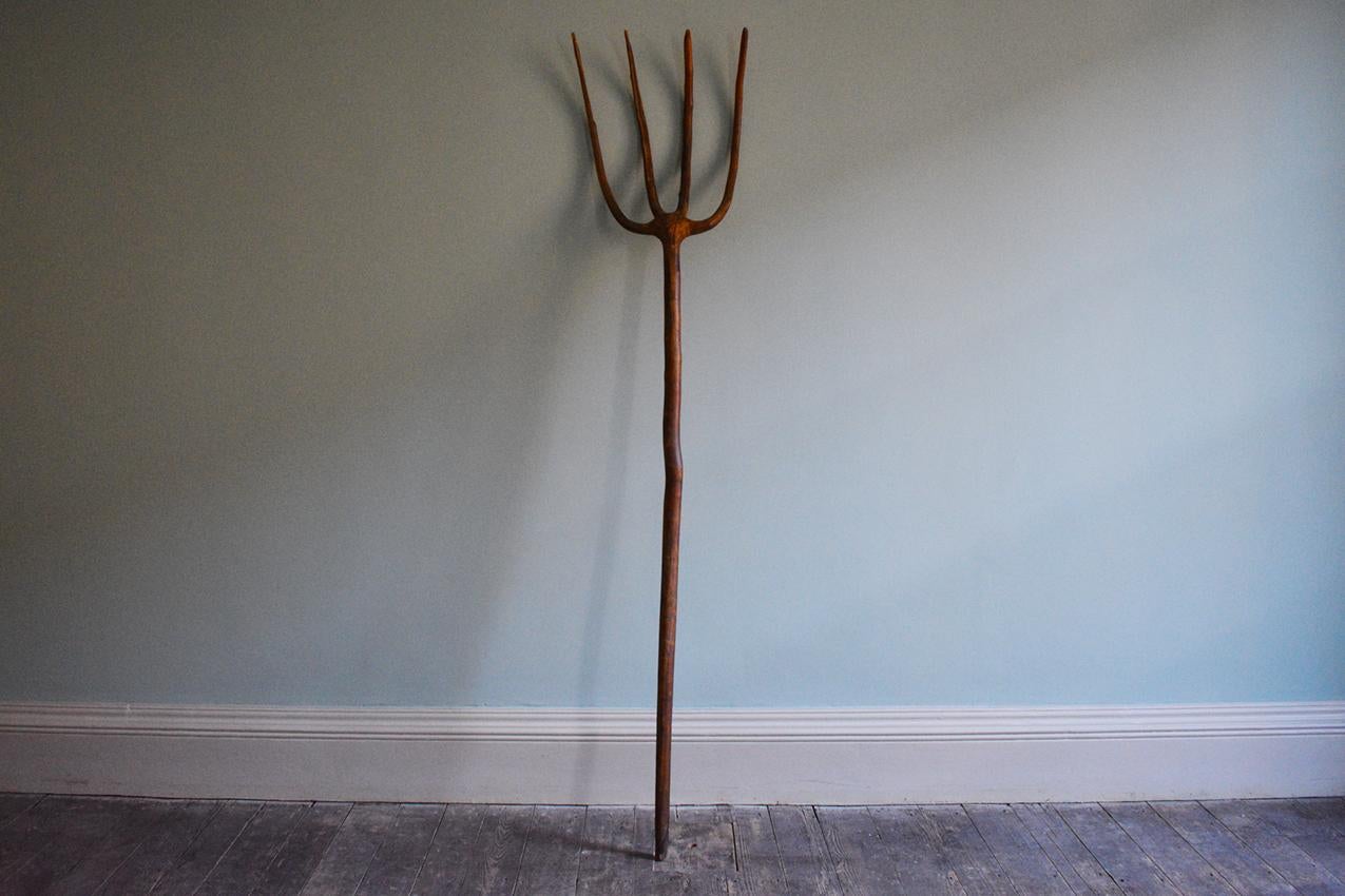 A farmers willow pitchfork, circa 1940.

Dimensions: H204 x W55 cm