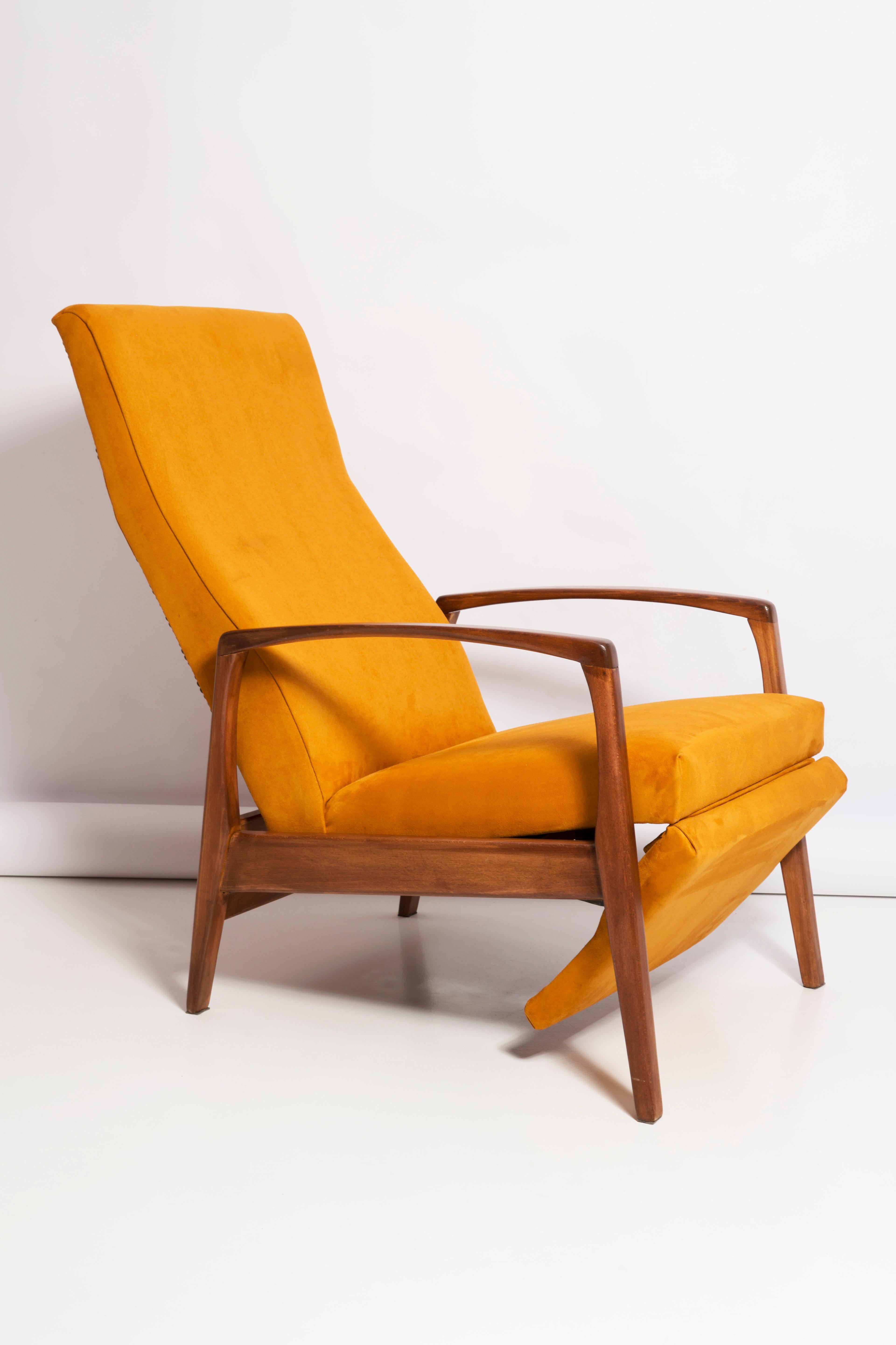 Very comfortable fold-out armchair, unusual model but captivating with its minimalism. Construction with armrests, turned legs made of beech wood.
Original mechanism of fold-out option works good. 

 These armchairs were manufactured in the 1960s