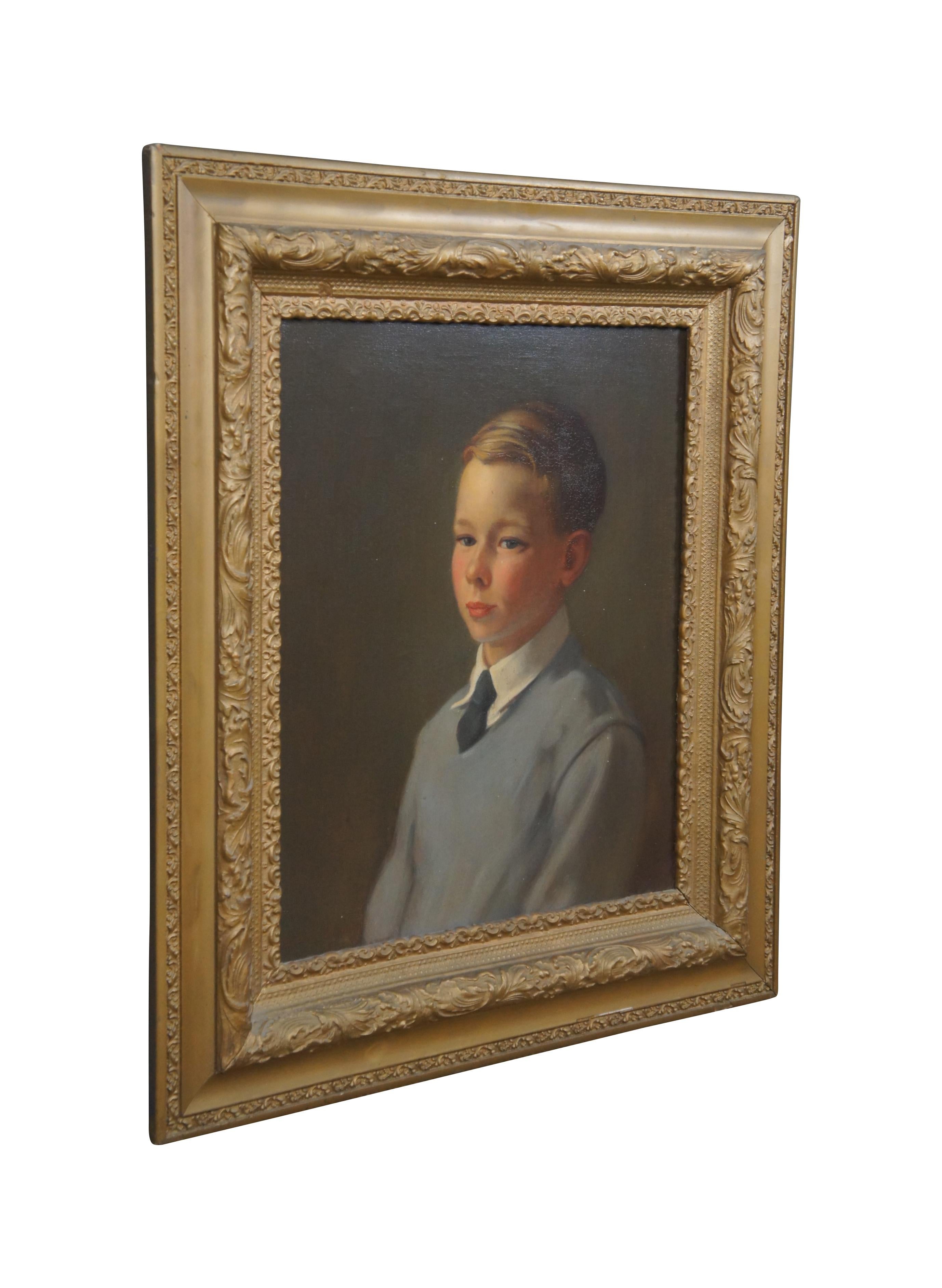 20th century oil painting on canvas. The portrait is of a young boy from the belly up. The boy is painted in a gray sweater with white collar shirt and blue tie. He has short dirty blonde hair with a comb over. Framed in a gold painted Victorian