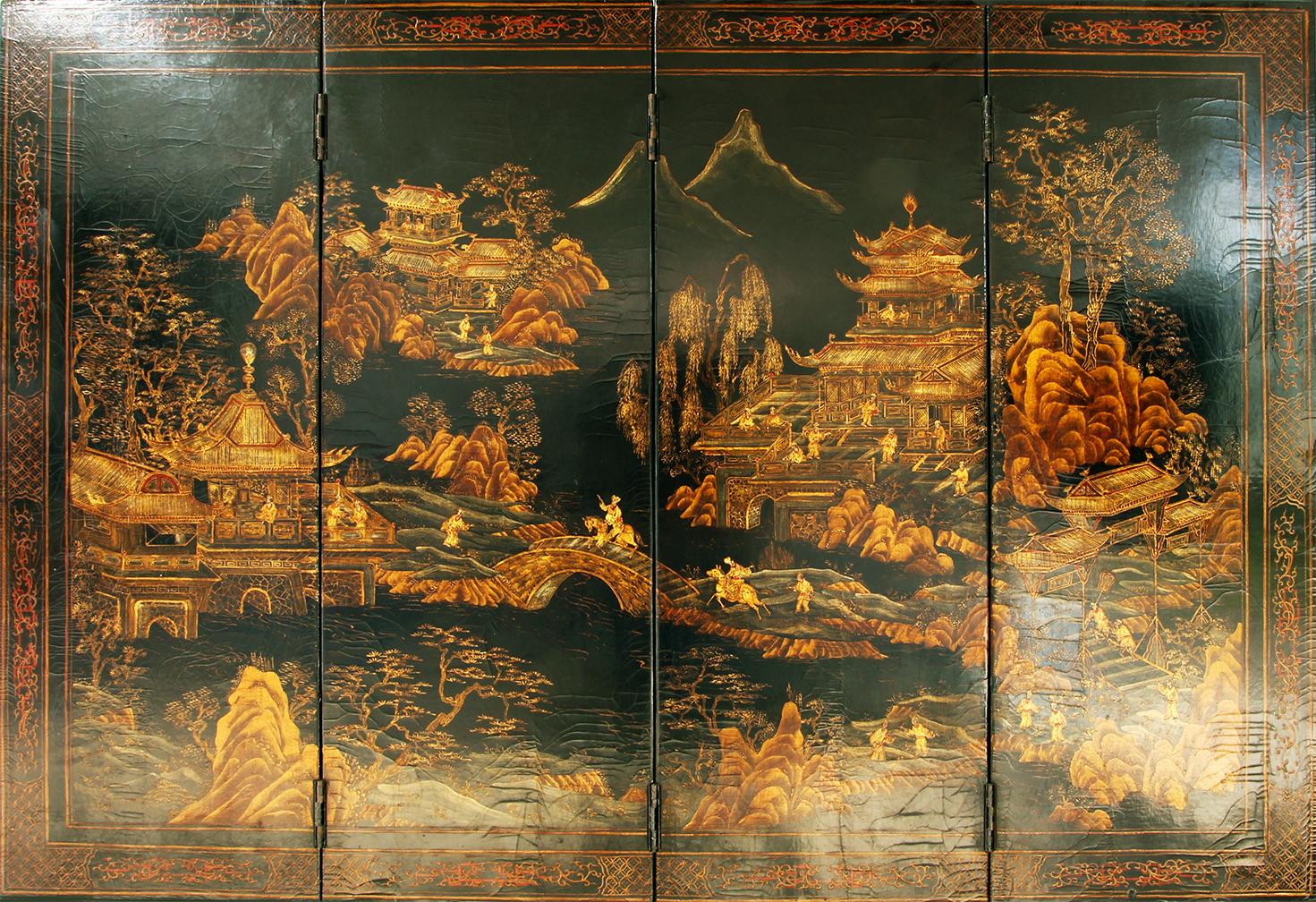 Small Chinese four panel wooden and black lacquer screen decorated in gold.