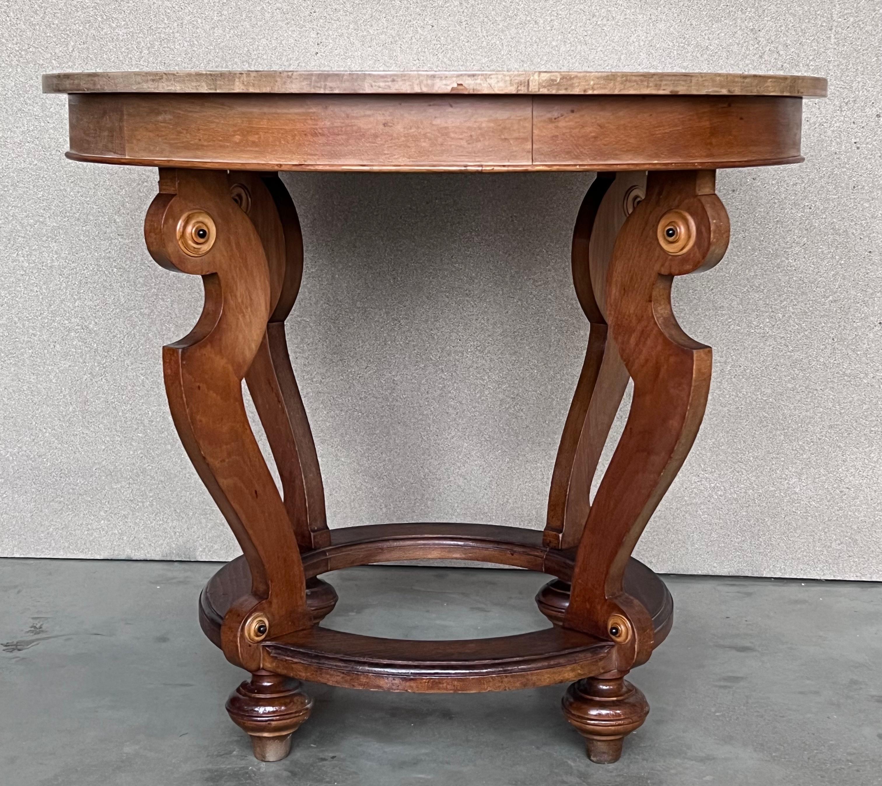 20th marquetry round center table with four cabriole legs.

We have two pieces available.