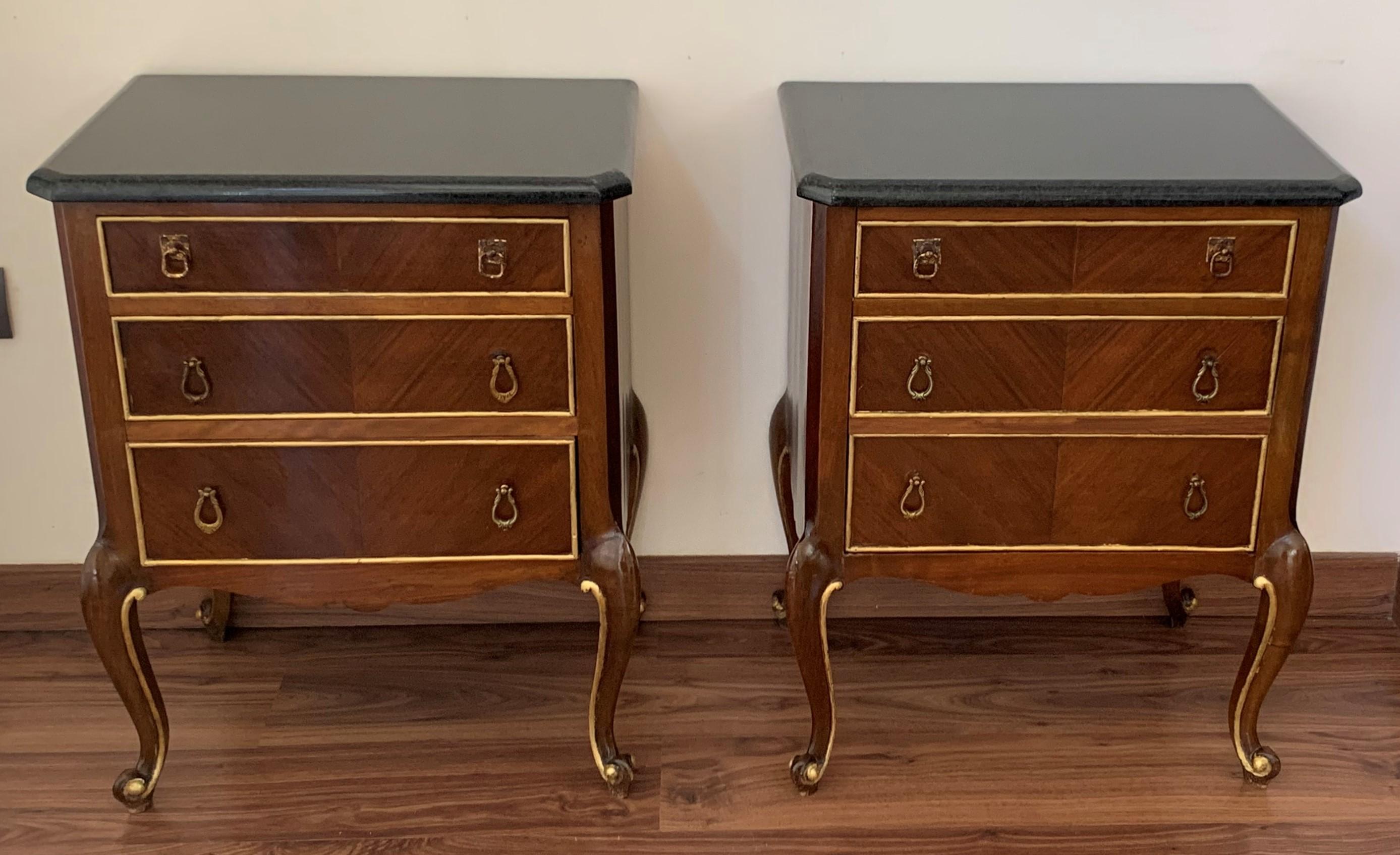 20th French pair of walnut nightstands with three different deep drawers
A petites French walnut three-drawer commodes from the mid-20th century with ribbon-giltwood . This petites French commodes features a rectangular top with beveled edges,